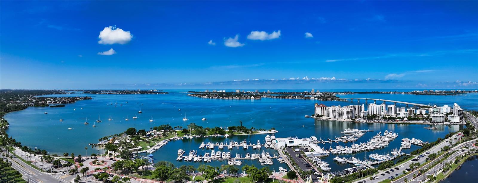 One or more photo(s) has been virtually staged. Live in the heart of Downtown Sarasota at a sought-after Palm Avenue address. A refined expression of form and function, this impeccably maintained New Construction 2 bedroom, 2 full bathroom residence offers timeless design and enduring value. Designed for both elegance and livability, the open floor plan is complemented by soaring 11-foot ceilings and exceptional storage throughout, including two built-out primary suite closets, a large pantry, and an oversized laundry room with a sink. The kitchen anchors the home with a premium Miele appliance package featuring a gas cooktop, upgraded Italian cabinetry, a custom Japanese ceramic tile backsplash, and a striking waterfall-edge island—ideal for everyday living and entertaining alike. Thoughtful upgrades continue with electric window treatments and a curated smart-home lighting system with ceiling fans, seamlessly blending modern convenience with classic appeal. Equally well suited as a sophisticated pied-à-terre, a full-time residence, or a long-term investment, the home is set within an intimate boutique building offering rooftop amenities including a temperature-controlled saltwater pool, a fitness center, and an elegant club room with a catering kitchen, along with 24/7 valet parking and security. A rare opportunity to own a luxury downtown condominium that combines lasting design, prime location, and lifestyle-driven value.