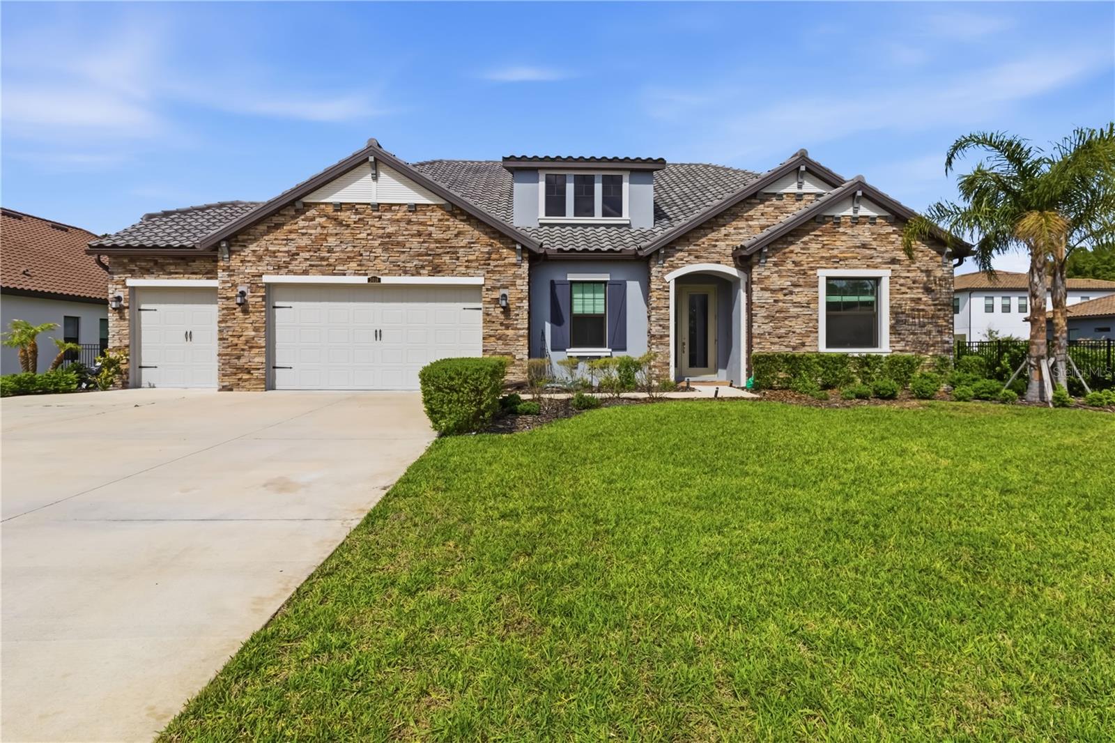 Luxuriously upgraded EAST-facing home in gated Cordoba Estates on a rare 0.62-acre lot backing to conservation with no rear neighbors. *This 3,033 sq ft home features 4 bedrooms, 3 baths, 3-car garage, private office with French doors, and a versatile flex room (office/gym/nursery). Enjoy ceramic tile throughout, high ceilings, and tray accents. Gourmet kitchen with 42” soft-close cabinets, quartz countertops, walk-in pantry, under-cabinet lighting, and spacious dining area. Expansive primary suite with spa-like bath, dual vanities, garden tub, large walk-in shower, and 2 custom walk-in closets. Includes whole-house water softener, RO system, and HVAC UV filtration. Massive backyard with serene conservation views. Resort-style amenities: pool, splash pad, playground, tennis/basketball courts, dog park. Prime location near Tampa Premium Outlets, Moffitt, airport & I-75/I-275. All measurements and details are approximate. Please verify if important.