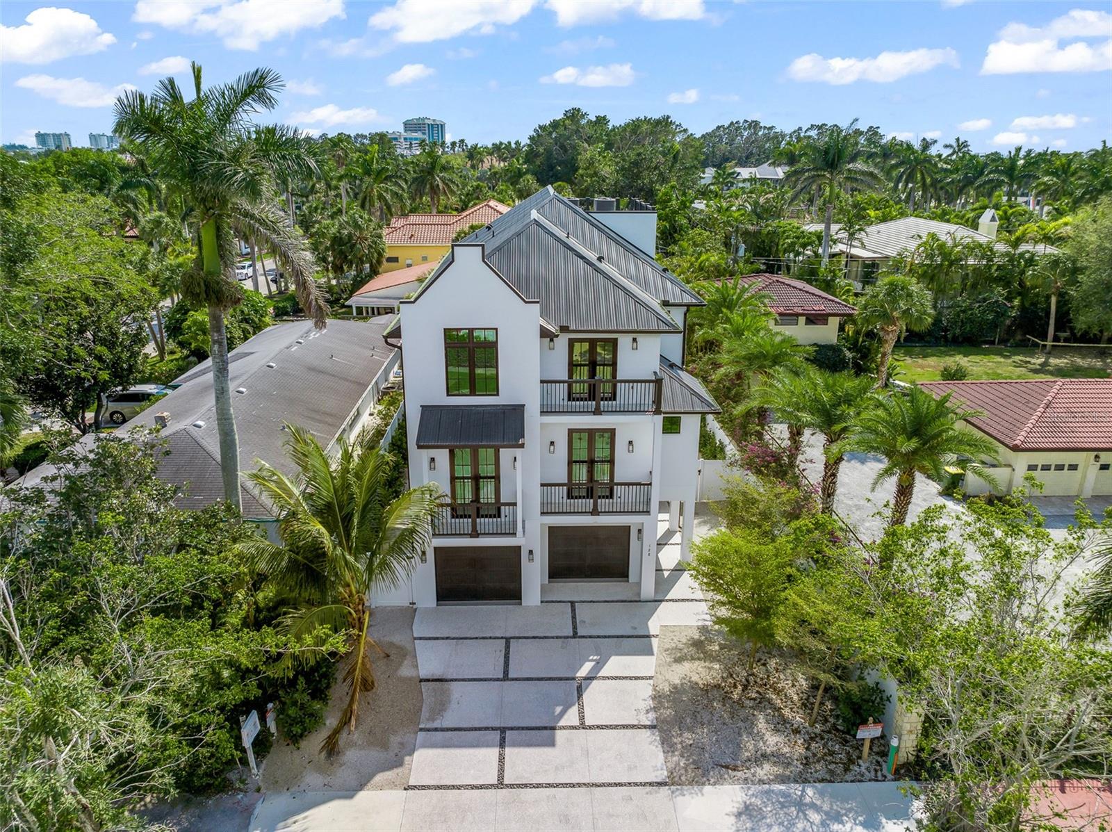 Discover an exceptional income-producing asset at 128 Fillmore Drive—an 8-bedroom, 8-bathroom luxury residence designed to perform at the highest level as a short-term vacation rental. Located just steps from world-renowned St. Armands Circle and minutes from the           white- sands of Lido Key, this newly built, turnkey-furnished property offers the rare combination of prime location, high-capacity accommodations, and resort-style amenities that today’s travelers seek.
Constructed with meticulous attention to durability and design, this home is purpose-built for both elevated living and strong rental performance. Expansive, sun-filled living areas and a coastal-contemporary aesthetic create a welcoming environment for large groups, while the gourmet chef’s kitchen—complete with custom cabinetry, quartz countertops, and premium appliances—supports effortless entertaining and extended stays.
Each of the eight bedrooms features an ensuite bathroom, maximizing guest privacy and boosting rental desirability. Multiple balconies and a stunning rooftop terrace provide views of Sarasota Bay and the lush surrounding neighborhood—an unforgettable highlight for vacationers and a standout feature in rental marketing.
The outdoor living experience is equally impressive, offering an oversized pool with a swim-up spa, generous patio space, and ample room for lounging or hosting gatherings. These resort-style amenities significantly enhance guest satisfaction and repeat bookings.
With its unbeatable walkability to high-end shopping, fine dining, vibrant nightlife, and cultural attractions, plus immediate access to Lido Key’s turquoise waters, this property consistently checks every box for travelers seeking a luxury coastal getaway.
Whether you’re expanding your portfolio or entering the short-term rental market, 128 Fillmore Drive represents a rare opportunity to acquire a high-performing asset in one of Sarasota’s most coveted destinations. This is more than a home—it’s a turnkey revenue generator in a premier vacation market.