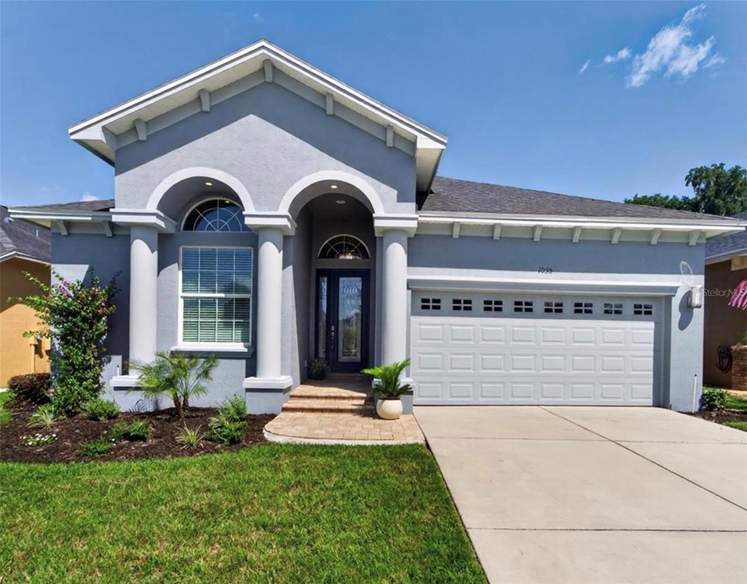 Enjoy privacy, thoughtful design, and effortless Florida living in this former Parade of Homes model located in the gated Stoney Creek community. With no rear neighbors and lawn maintenance included, this beautifully upgraded home offers a peaceful setting without sacrificing convenience.
Inside, the spacious open-concept floor plan is elevated by soaring 14-foot ceilings, elegant coffered details, and upgraded wide-plank tile flooring. The kitchen makes a striking impression with custom blue solid-wood cabinetry, premium quartz countertops, a waterfall-edge island, custom range hood, and walk-in pantry with built-in shelving.
Expansive pocket sliding doors open to a large L-shaped screened lanai, creating a seamless connection between the indoor and outdoor living spaces. The private backyard offers mature landscaping and plenty of room to create a future pool or personalized outdoor retreat.
The home includes three bedrooms and a flexible office or fourth bedroom with a cathedral ceiling. Additional features include an epoxy-coated two-car garage, attic storage, regularly serviced HVAC systems, replaced thermostats, and freshly painted exterior. Residents also enjoy access to the community clubhouse and pool.