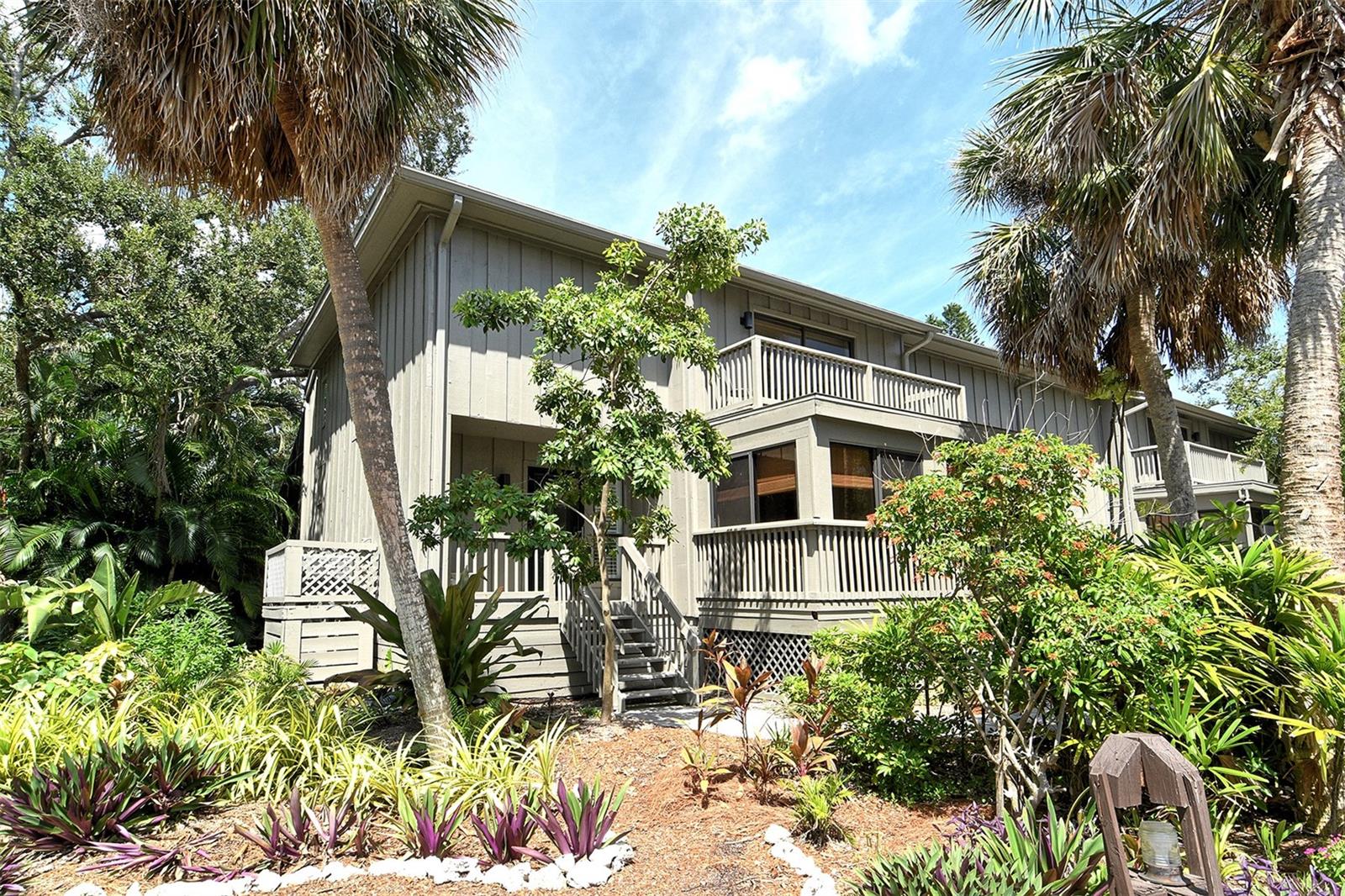 Welcome to The Landings Treehouse, one of Sarasota’s most sought-after gated communities. This spacious 3-bedroom, 2.5-bath residence offers over 2,000 sq. ft. of living space with a thoughtfully designed open floor plan that balances comfort and style. The main level features a bright living and dining area with soaring ceilings, skylights, a cozy fireplace, and access to a private lanai surrounded by lush tropical landscaping. The updated kitchen boasts granite counters, a center island, breakfast bar, solid wood cabinetry, and stainless-steel appliances—perfect for both everyday living and entertaining.

Upstairs, the primary suite offers a walk-in closet, high ceilings, and a spa-inspired bathroom with skylights that fill the space with natural light. Two additional bedrooms provide plenty of room for guests, one with its own en suite bath. Throughout the home, you’ll find luxury vinyl and tile flooring, designer finishes, and built-in features that enhance functionality.

Set among mature trees and serene nature, The Landings Treehouse community is known for its exclusive amenities, including a heated community pool, tennis courts, walking trails, and private access to the Intracoastal Waterway through the Landings Racquet Club (membership optional). This desirable location places you just minutes from Siesta Key Beach, Downtown Sarasota, St. Armands Circle, and a variety of shopping, dining, and cultural attractions.

With its generous floor plan, resort-style amenities, and unbeatable location, this home is the perfect opportunity to enjoy the relaxed yet vibrant Sarasota lifestyle.

The quarterly fee includes flood insurance, roof, outdoor maintenance and landscaping, gutter cleaning, pest control, Treehouse community pool, kayak launch, cable, internet. No additional assessments.