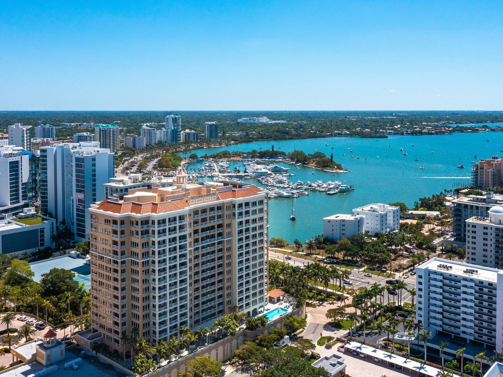 Welcome to refined Ritz-Carlton living on Sarasota Bay, where you can experience timeless elegance in this rare corner residence at The Ritz-Carlton Tower Building, and every detail has been thoughtfully reimagined for modern luxury. Positioned to capture sparkling bay waters and lively energy of Sarasota’s cityscape, this home offers luminous morning sunrises, breathtaking evening sunsets and a glittering skyline by night. Inside, expansive windows wrap the living spaces in natural light, while refined designer finishes create a serene and sophisticated backdrop. The chef’s kitchen is a centerpiece, with dramatic quartzite countertops, all-new Wolf and Sub-Zero appliances, and a custom bar ideal for entertaining. Custom built-ins throughout elevate form and function. With two spacious bedrooms plus an additional bedroom set up as an office, three full baths, and multiple terraces, including an oversized patio ideal for alfresco dining with water views, this residence blends comfort and elegance at every turn. Private elevator entry, premium finishes, exquisite wall coverings, and thoughtful design selections further enhance the sense of ease and refinement. Life at The Ritz-Carlton extends far beyond the residence. The building has been recently refreshed with a newly reimagined lobby and enhanced by commercial flood protection for peace of mind. From the convenience of valet and concierge service to world-class amenities, every element ensures a lifestyle defined by security, sophistication and the legendary Ritz-Carlton standard of excellence. This is more than a home, it is a rare opportunity to embrace the best of waterfront serenity and cosmopolitan energy, with the prestige of Ritz-Carlton living.
