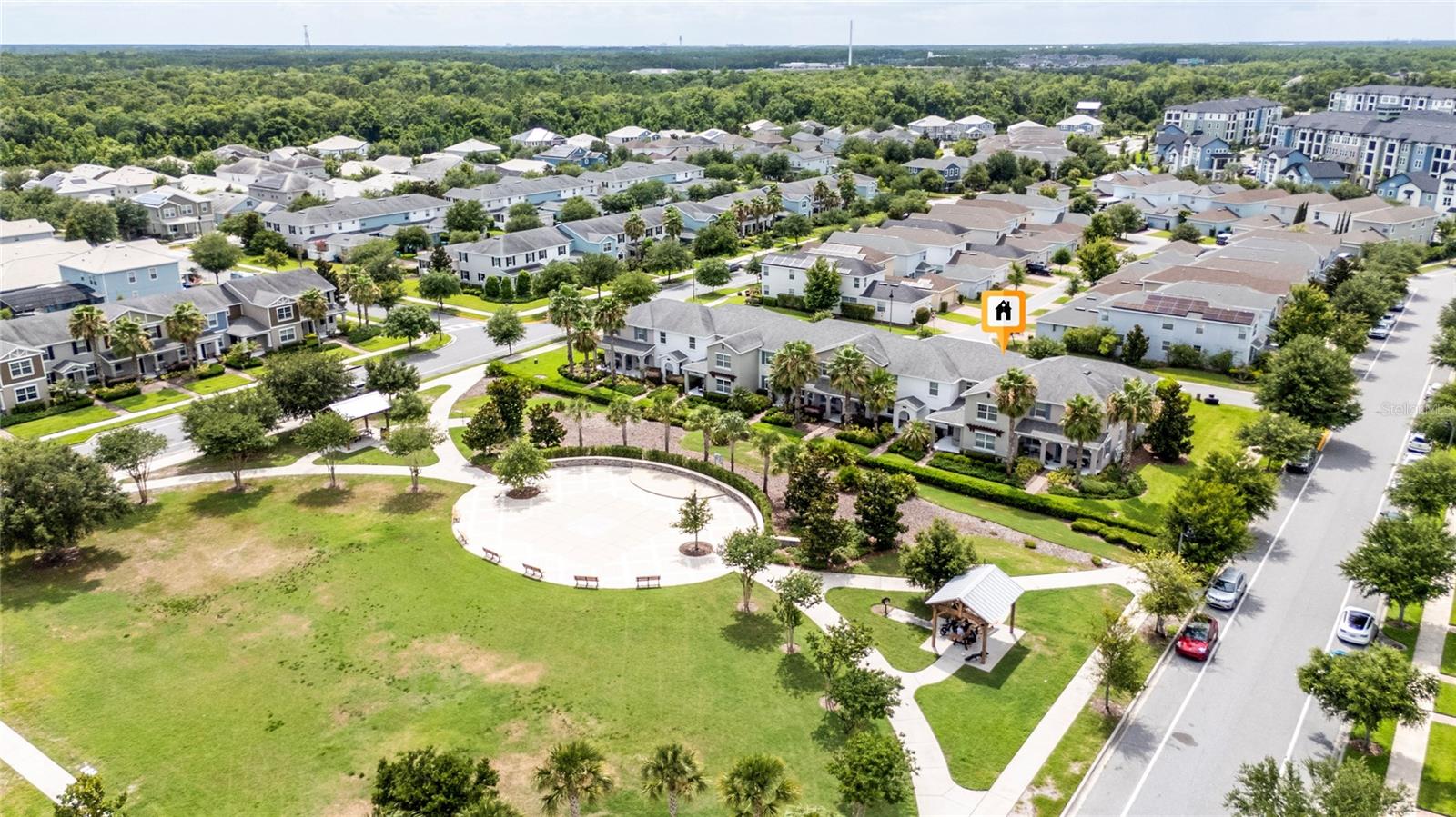 Virtually Staged. Welcome to this beautifully maintained 4-bedroom, 2.5-bath townhome located in the highly desirable Storey Park community in Lake Nona. Freshly painted and thoughtfully designed, this home offers a versatile open-concept layout that seamlessly connects the living room, dining area, and kitchen, creating the perfect space for both everyday living and entertaining.The spacious kitchen features granite countertops, tall cabinetry, and a large breakfast bar that enhances the flow between living spaces. The primary suite is conveniently located on the first floor, providing privacy and comfort. Upstairs, you'll find three additional bedrooms, a full bathroom, and a generous loft area that can be used as a second living room, home office, playroom, or flex space to fit your needs.Step outside to enjoy a completely private courtyard-style patio situated between the home and the detached two-car garage. A covered walkway provides convenient access from the garage to the rear entrance of the home, offering comfort and protection from the elements.Ideally positioned directly across from a beautiful community green space, this home is also just a short distance from the neighborhood schools and the resort-style clubhouse amenities. Enjoy all that Storey Park has to offer, including pools, parks, walking trails, fitness facilities, and more, all within the vibrant Lake Nona area.Don't miss this opportunity to own a move-in-ready home in one of Central Florida's most sought-after communities.