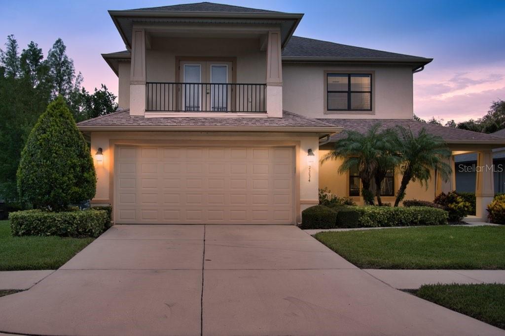 Virtually Staged. LUXURY DUNEDIN RETREAT WITH TWO PRIMARY SUITES AND A THOUGHTFUL MULTI-GENERATIONAL DESIGN! Welcome to this beautifully appointed 5-bedroom, 4.5-bathroom residence offering 3,056 square feet of living space, a highly desirable split floor plan, and exceptional flexibility for today's lifestyle. Situated on a spacious homesite in Dunedin, this two-story home combines elegant finishes, generous living areas, and an abundance of indoor and outdoor entertaining space. Step inside to discover rich wood flooring, soaring ceilings, and an open-concept layout designed for both everyday comfort and effortless entertaining. The chef-inspired kitchen serves as the heart of the home, featuring granite countertops, stainless steel appliances, custom wood cabinetry, a large center island with seating, built-in wall oven and microwave, decorative tile backsplash, and extensive storage and prep space. The kitchen overlooks the spacious family room, creating a seamless flow for gatherings of any size. One of the home's standout features is its dual primary suite design, offering a luxurious primary retreat on both the first and second floors. The downstairs primary suite provides privacy and convenience while featuring direct access to the covered rear patio, creating the perfect spot to enjoy morning coffee or unwind in the evening. The ensuite bath includes dual vanities, granite countertops, a spacious walk-in shower, and generous storage. Upstairs, the second primary suite offers its own private sanctuary complete with an ensuite bath and access to a covered balcony overlooking the property. The second floor also features a large loft area at the top of the stairs, ideal for a media room, playroom, home office, or additional living space. Two secondary bedrooms are connected by a convenient Jack-and-Jill bathroom, while an additional bedroom and full bath provide comfortable accommodations for family and guests.
Outdoor living is equally impressive with a large covered rear patio overlooking the partially fenced backyard. The expansive yard provides plenty of room for pets, play, gardening, or the future addition of a pool, while still leaving ample space for entertaining and outdoor activities. Designed with both comfort and peace of mind in mind, the home features impact-resistant windows across the front elevation and storm shutters for the remaining windows and exterior doors, providing valuable hurricane protection and enhanced security. Additional highlights include a 2-car garage, spacious laundry room, abundant storage throughout, multiple living and gathering areas, and a versatile floor plan that easily accommodates multi-generational living, long-term guests, or work-from-home needs. Ideally located near Dunedin's vibrant downtown district, waterfront parks, beaches, dining, shopping, and recreational amenities, this exceptional property offers the perfect combination of space, flexibility, and Florida lifestyle living. Schedule your private showing today and experience everything this remarkable home has to offer.