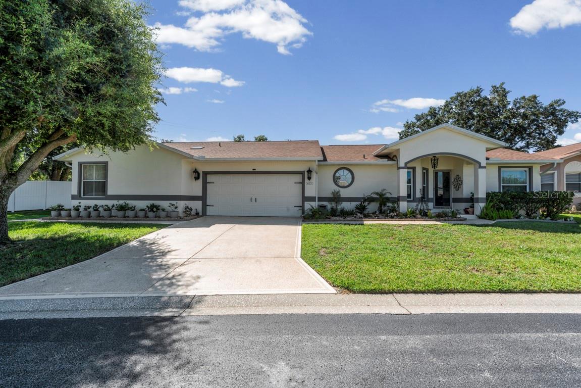 POOL HOME + IN-LAW SUITE in SILVER LAKES 55+ GATED COMMUNITY
Beautifully maintained 3-bedroom, 3-bathroom home with a 2-car garage and private solar-heated saltwater pool in the resort-style gated community of Silver Lakes. This light and bright home features high ceilings, an open floor plan, plantation shutters, and brand-new LVP flooring throughout, plus new carpet in the bedrooms. The split triple layout offers excellent privacy and versatility. The kitchen showcases granite countertops, GE appliances, a pantry, a breakfast bar, and a cozy eat-in nook with sliding doors leading to the pool area. The spacious living room overlooks the pool through large windows, creating the perfect indoor-outdoor flow. The owner's suite includes a walk-in closet, direct pool access, and an ensuite bath with a large walk-in shower, solid-surface vanity, and linen closet. A second guest bedroom and bath are located at the front of the home. The IN-LAW SUITE/APARTMENT features its own private entrance, screened porch, separate A/C, kitchen, living room, bedroom with walk-in closet, and ensuite bath with a tiled walk-in shower—ideal for parents or guests. Outdoor living shines with the solar-heated saltwater pool, rescreened enclosure, lush landscaping, and a 10-foot vinyl privacy fence. Recent updates include: driveway and sidewalks resurfaced (2023), interior paint (2021), pool enclosure painted and rescreened (2020), dual-pane windows (2020), pool pump motor (2018), roof (2015), gas water heater (2014), and A/C units (2025 and 2009). HOA includes cable, internet, lawn care, and reclaimed irrigation water. Community amenities include a heated pool and more. Schedule your private showing today!