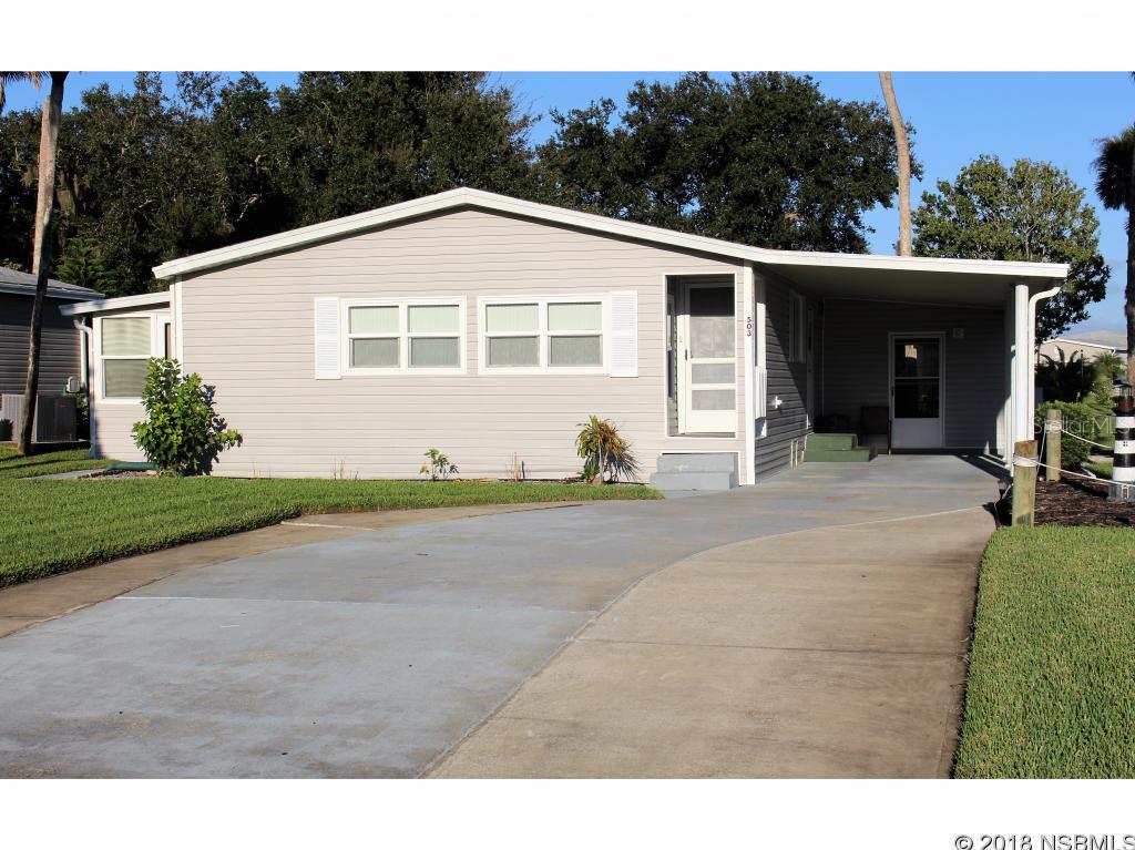 This quaint two-bedroom, two bath home is located on an oversized corner lot. The home features an open floorplan with a spacious living room, plenty of counter space in the kitchen and large closets in both bedrooms. Located within walking or biking distance to the clubhouse, heated swimming pool and tennis courts. NOT a rental community - OWN YOUR OWN PROPERTY!!! Lighthouse Cove is a beautiful riverside gated community located in Oak Hill in one of the world's premier fishing areas on the Indian River Intracoastal Waterway. The community features a clubhouse, heated swimming pool, picnic pavilions and a small boat launch that will accommodate smaller boats. Activities galore!! All measurements are approximate. ;Water: City