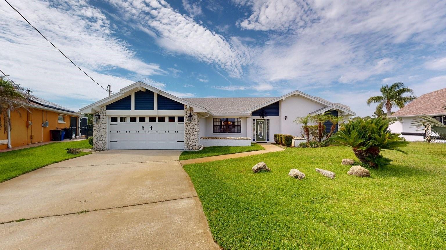 Virtually Staged. Waterfront Living at Its Finest! Welcome to this beautifully updated canal-front home offering the perfect blend of luxury, comfort, and Florida lifestyle. Situated on a desirable waterfront homesite, this stunning residence features 8 spacious rooms, 2 bathrooms, and breathtaking water views from nearly every angle.
The heart of the home is the newly remodeled chef's kitchen, complete with gorgeous leathered granite countertops, a large center island, wine refrigerator, double ovens, abundant cabinetry, and premium finishes designed for both everyday living and effortless entertaining.
Elegant travertine flooring flows throughout the home, while the inviting fireplace creates a warm and welcoming atmosphere. The spacious primary suite serves as a private retreat, featuring serene water views and a luxurious soaking tub perfect for relaxation.
Step outside to your own waterfront paradise. The entire rear of the home overlooks the canal, creating a spectacular backdrop for daily living. Enjoy the heated pool year-round, unwind beneath the expansive covered lanai, or entertain family and friends while taking in the peaceful water views. Boating enthusiasts will appreciate the private boat dock, providing direct access to the water right from your backyard.
Whether you're hosting large gatherings, enjoying sunset cocktails by the pool, or heading out for a day on the water, this exceptional property offers the ultimate Florida waterfront lifestyle. A rare opportunity to own a move-in-ready canal home with premium upgrades, stunning views, and endless possibilities for entertaining.