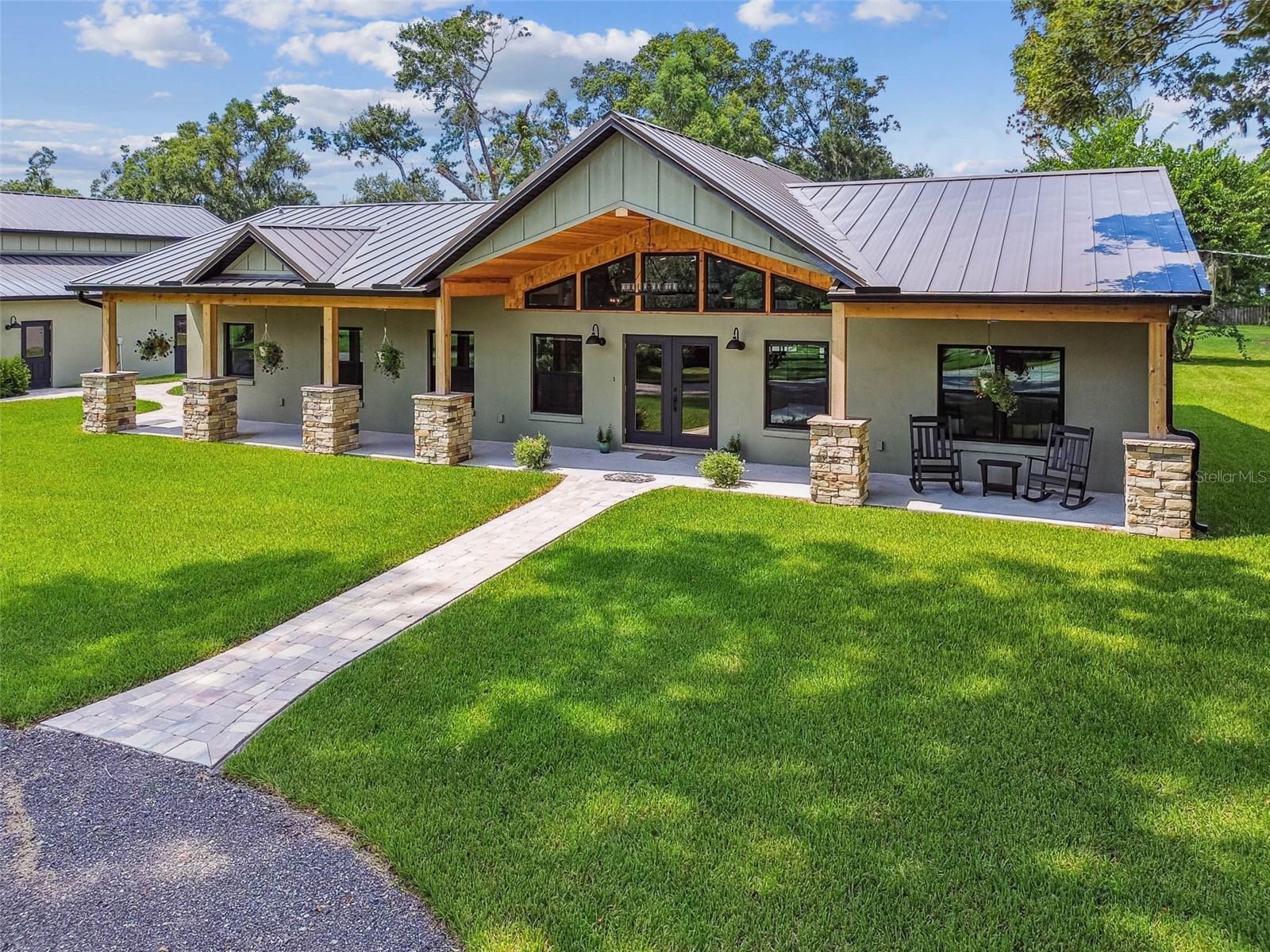 “SIGNIFICANT PRICE ADJUSTMENT – INCREDIBLE VALUE in Land alone”  **One-of-a-Kind Equestrian Estate in Lithia – Over 15 Acres. A rare opportunity awaits with this extraordinary property, offering three separate 5-acre parcels for a combined total of more than 15 acres of pristine countryside. Whether you envision a private retreat, a working equestrian estate, or future development potential, this property is truly one-of-a-kind. At the heart of the estate sits a brand-new, custom-built home spanning over 2,500 sq. ft. with 3 bedrooms and 3 full baths. Step inside to soaring cedar-lined ceilings, Acacia hardwood flooring throughout, and a stunning stone fireplace anchoring the open-concept living area. The chef’s kitchen features Z Line appliances, a 6-burner gas stove, quartz countertops, a hidden pantry, and premium soft-close cabinetry with under-cabinet lighting—perfect for both everyday living and entertaining. The owner’s suite is a true retreat with French doors to the lanai, a custom walk-in closet, and a spa-inspired bath showcasing a massive glass-enclosed shower, freestanding tub, and LED mirrors. Every window and door meets 2025 hurricane-rated standards for ultimate peace of mind. Step outside to a private screened lanai with a brand-new heated saltwater pool and spa, overlooking wide-open pastures. A professional pickleball court adds to the lifestyle amenities, while cross-fencing, metal gates, and full irrigation provide functionality for the acreage. Equestrians will appreciate the horse barn, offering six stalls with water and electric at each, ceiling fans, plus two climate-controlled rooms—one for office space and one for feed storage. Car, RV, and toy enthusiasts will love the oversized garage complex, including a full-size RV bay, room for up to 5 vehicles (or 3 plus RV), 4 garage doors with rear access, and a temperature-controlled storage room. All structures are topped with long-lasting metal roofs with a 30-year lifespan. A combination of wood privacy fencing and cross-fenced pastures provides both beauty and practicality. Perfectly situated just 40 minutes from Downtown Tampa and mere minutes from the FishHawk Sports Complex, this estate lies within the top-rated FishHawk school district—offering the tranquility of a country lifestyle without compromising city convenience. This is more than a home—it’s a lifestyle. Whether you’re an equestrian, hobby farmer, or simply seeking a luxury retreat, this estate is unmatched. Three - 5 acres parcels with endless possibilities- Schedule your private showing today and discover the endless possibilities. DO NOT DRIVE down road to look, private property on a dead end road. No trespassing. Appointments ONLY.