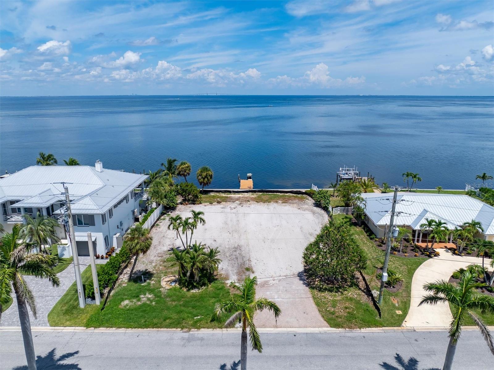 VACANT, CLEARED AND READY TO GO! Discover a truly exceptional opportunity to own one of the finest Bayfront lots on Anna Maria Island, nestled in the exclusive boating and golfing enclave of the Key Royale neighborhood. This build-ready, deep-water lot spans approximately 15,000 sq. ft., offering an impressive 100 feet of direct frontage on Tampa Bay.
Whether you're envisioning a private waterfront estate or a vacation retreat, the lot’s generous size and prime location offer unlimited potential.
Enjoy easy access to the Gulf, serene sunrises over the bay, and world-class boating right from your backyard. Plus, you're just a short stroll or golf cart ride from Anna Maria Island’s top-rated restaurants, boutique shops, and sugar sand beaches.
Don't miss this rare chance to build your dream home in one of the most desirable waterfront settings on Florida's Gulf Coast.