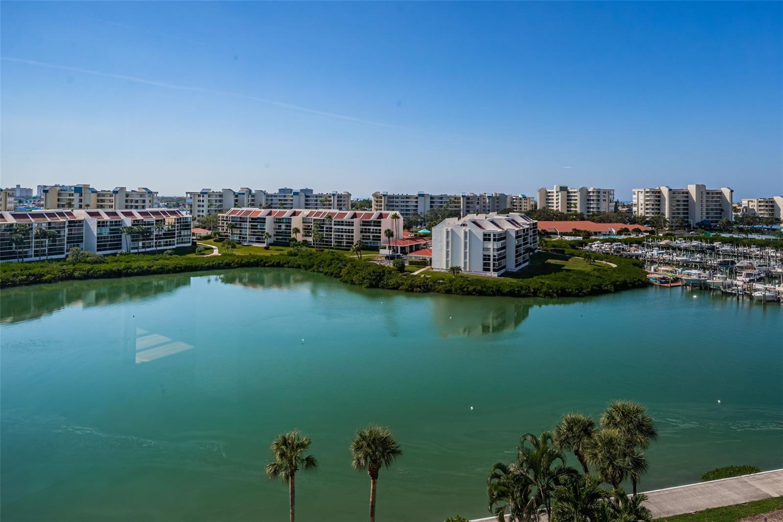 One or more photo(s) has been virtually staged. $20,000 PRICE REDUCTION!! A MUST SEE PENTHOUSE CONDO. Welcome to coastal living in this completely redesigned and completely updated 2-bedroom, 2-bathroom penthouse condominium. Perfectly positioned in the Ambassador building at the sought after Bay Island Community in South Pasadena. This penthouse offers breathtaking, unobstructed views from every room. This home features new flooring throughout, sleek appliances, and all new cabinets in the kitchen; both bathrooms have been updated with double sinks and marble floors. A brand new, stackable washer and dryer has been installed for your convenience of doing laundry at home. Expansive windows flood the space with natural light and gorgeous views of Boca Ciega Bay and the Gulf of Mexico! The spacious master suite offers a walk-in closet and en-suite bathroom. The unit comes with an additional storage unit on the same floor. The Ambassador building has passed the Milestone Inspection and Structural Integrity Report, providing you with peace of mind. Bay Island is a vibrant community offering resort-style amenities: cable, internet, WIFI, trash, water, sewer, flood insurance included. Along with a 24-hour guarded security gate. The clubhouse features a ballroom, kitchen, saunas, arts and crafts studio, library, game rooms, billiards and social areas. Outdoor features include two spas, six heated pools, tennis courts, pickle ball courts, grill stations, fishing docks, marina and boat slips (boat slips purchased separately). Surrounding the entire Bay Island complex is a waterfront walking trail. Two small pets are allowed (under 15 lbs). Bay Island is ideally located just minutes to St. Pete Beach and Treasure Island. A small shopping center is located just outside the guard gate with restaurants, hair salon, etc. A short 10-minute walk over the Corey Bridge brings you to Horan Park, which offers bands and festivities on the weekends. The Corey Avenue Sunday Market offers fresh fruit and fresh produce among other items. Corey Avenue offers restaurants, bars, nightlife, shopping, and the Beach Theater. An HCA hospital is located in South Pasadena. Downtown St. Petersburg is a short 20-minute drive. St. Petersburg, many museums, art galleries, shopping, sports activities, festivals, restaurants, and nightlife. St. Pete-Clearwater International Airport and Tampa International Airport both a short distance from South Pasadena.
