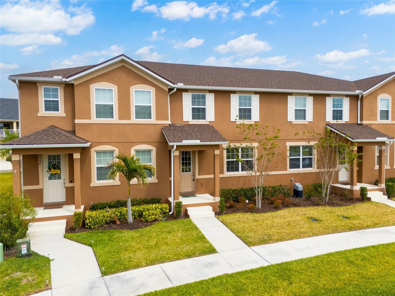 Welcome to this beautifully maintained townhome in the sought-after Waterbrooke community! Built in 2021, this move-in-ready home offers 3 bedrooms, 2.5 bathrooms, and a bright, open-concept floor plan designed for comfortable everyday living. The spacious kitchen flows seamlessly into the dining and living areas, creating an ideal space for entertaining and gathering. The primary suite offers a generous layout with a private en-suite bath, while the additional bedrooms provide flexibility for family, guests, or a home office. Residents enjoy an outstanding selection of community amenities, including a clubhouse, fitness center, resort-style pool, splash pad, dog park, playground, scenic walking trails, and two beautiful lakes. Conveniently located less than 3 miles from Costco and Orlando Health South Lake Hospital, approximately 6 miles from Clermont Waterfront Park, and just minutes from shopping, dining, schools, and major roadways. Lawn maintenance is included for added convenience. Don't miss this opportunity to own a beautiful home in one of Clermont's most desirable communities. Schedule your private showing today!