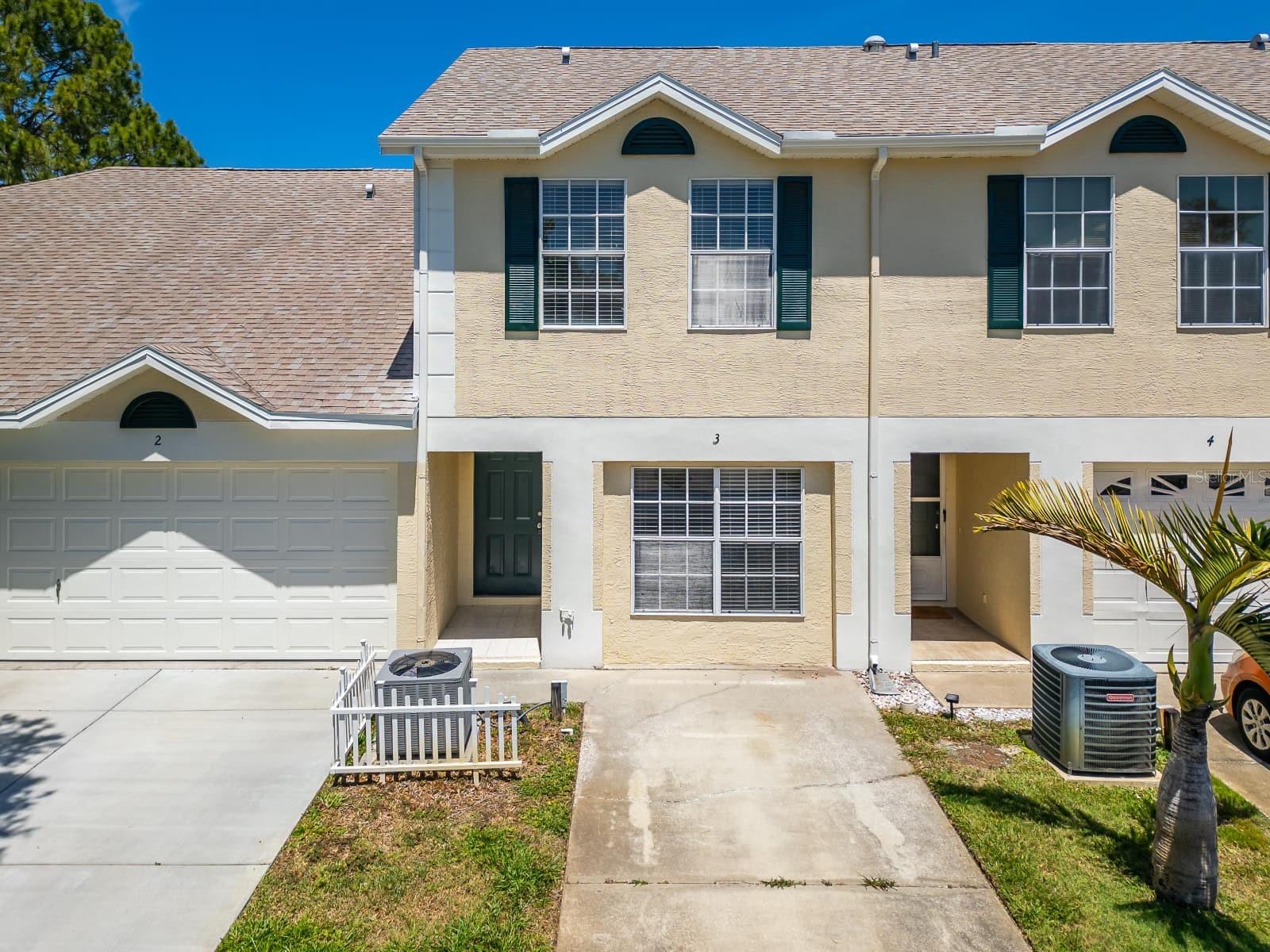 Fall in love with this inviting 2-bedroom, 2-bath townhouse in Green Valley Estates. Flexible opportunity—available to rent for $1,950/month, purchase for $285,000, or lease with an option to purchase (rent-to-own)! The main level features a bright, open-concept layout that seamlessly connects the kitchen, dining, and living areas, ideal for everyday living and entertaining. The private upstairs primary suite offers vaulted ceilings, plush carpeting, a walk-in closet, and a well-appointed bathroom. The second bedroom is conveniently located near the interior laundry area, adding functionality. Enjoy the Florida lifestyle with community amenities that include a resort-style pool, lounge area, pool shower, and a clubhouse with a sauna, perfect for relaxing or hosting gatherings.