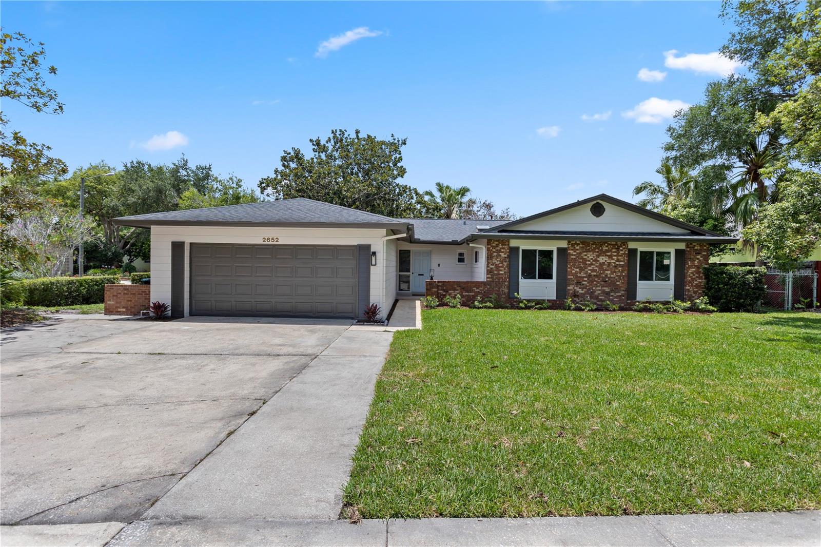 Welcome to 2652 Abbey Road, a beautifully renovated home tucked away on a quiet cul-de-sac in the highly desirable Winter Park Estates community. Situated on a spacious corner lot, this stunning 4-bedroom, 2-bath residence with a dedicated office offers the perfect blend of modern design, functionality, and location.

From the moment you step inside, you'll appreciate the open-concept floor plan designed for today's lifestyle. New flooring flows seamlessly throughout the home, complemented by updated interior doors, abundant natural light, and thoughtfully selected finishes. The private office, featuring elegant double glass doors, provides the perfect space for working from home, a playroom, or a flex space to fit your needs.

The heart of the home is the completely redesigned kitchen, showcasing beautiful natural-tone soft-close cabinetry, sleek black hardware, premium stainless steel appliances, and luxurious Level 6 countertops that create both style and functionality. The spacious living and dining areas flow effortlessly together, making entertaining family and friends a breeze.

The primary suite serves as a private retreat, featuring a large walk-in closet, dual vanity, and a beautifully appointed walk-in shower with designer finishes. Three additional bedrooms provide ample space for family and guests, while both bathrooms have been tastefully updated with modern touches throughout.

Beyond the cosmetic updates, this home offers peace of mind with major improvements including a newer roof (2021), double-pane windows and sliding glass door (2021), updated HVAC system, new AC ductwork, new sprinkler system, and fresh sod. Every detail has been thoughtfully addressed to provide a truly move-in-ready experience.

Outside, the oversized corner lot offers plenty of room to relax, entertain, or enjoy the mature surroundings of this established Winter Park neighborhood. The location is hard to beat, with easy access to Sprouts, Publix, Costco, Baldwin Park, Park Avenue, top-rated dining, boutique shopping, and major roadways connecting you to everything Central Florida has to offer.

Combining quality renovations, flexible living spaces, and one of Winter Park's most convenient locations, 2652 Abbey Road presents a rare opportunity to enjoy modern living in an established neighborhood without sacrificing character or charm.