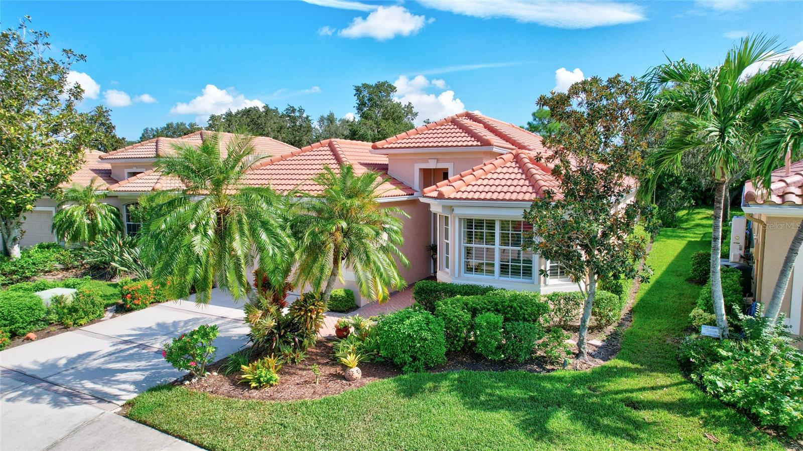 Discover this move-in ready Gem in the maintenance-free Somerset neighborhood within Turtle Rock on Palmer Ranch.  Pride of ownership is evident throughout this 3-bedroom, 2-bathroom  Lee Wetherington designed home which boasts an open-flow floorplan & efficient design. Light & bright interiors with 9-11 ft. ceilings & tiled flooring throughout provides both gracious living & easy maintenance.  The Heart of the Home beckons where the chef’s kitchen awaits, complete with solid-wood cabinetry, granite countertops and newer appliances. The bar top & café seating take advantage of the aquarium glass view of the spacious outdoor living area. The fully renovated primary ensuite offers spa-like convenience & comfort. Enjoy the versatility of the multi-purpose room with a glass slider to the screened lanai, connected to the primary suite, and a den/office/3rd bedroom with French doors & a dedicated closet. The outside living space is a true oasis, featuring a heated pool with a waterfall & al fresco dining all within a screened lanai & surrounded by sub-tropical custom landscaping that provides privacy and a lush environment. The home also includes a 2-car garage with a new hurricane door, hurricane shutters & lanai storm curtain. No CDD Fees & NOT located in a Flood Zone.  This meticulously maintained & continuously updated home by the original owners has built-in niches, glass block windows in several living spaces adding charm and functionality to this feature property.  The gated Turtle Rock Community offers overs 500 acres of mature natural Florida beauty & residents enjoy a range of amenities including a geothermal heated lap pool, pickleball & tennis courts, a basketball court, fenced playground, a 1.4 mile interior nature trail & community center.  Centrally located within Palmer Ranch, Turtle Rock is 20 minutes north to Cultural Downtown Sarasota or south to Downtown Venice, 15 minutes to several world-renowned Gulf Beaches & adjacent to the 20-mile Legacy Trail for walking/jogging/bicycling.  Embrace the outdoor Sarasota-Sunshine lifestyle & make this exceptional property your own!