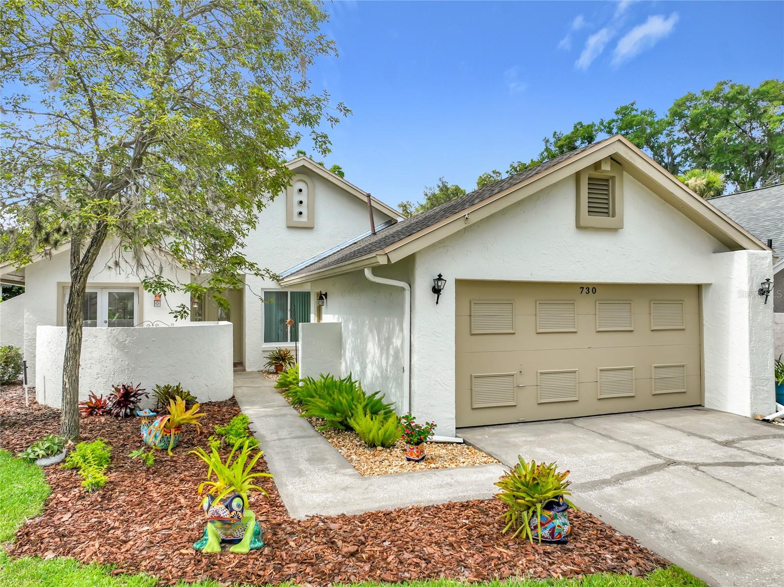 Virtually Staged. Some addresses tell you where you live. Others help define how you live. Located on a quiet cul-de-sac within a gated lakefront community, this beautifully updated home combines comfort, convenience, and an exceptional setting that appeals to every stage of life.  Inside, quality improvements are evident throughout. The kitchen features granite countertops, maple cabinetry with custom storage features, a breakfast bar, eat-in dining area, bow window over the kitchen sink, and French doors with a retractable screen overlooking the front garden. Updated baths, vaulted ceilings, skylights, laminate wood flooring throughout, updated lighting, and a wood-burning fireplace create spaces that feel both inviting and functional. Adding to the home's value and providing peace of mind for years to come, a brand-new roof was just installed in June 2026. Outside, attractive landscaping, a fenced yard, and a large screened and tiled patio expand the home's living area outdoors, creating an inviting connection to Florida's year-round outdoor environment. Additional features include an inside laundry room and gutters. The lifestyle beyond the front door is what truly sets this community apart. Lakeside tranquility, picturesque ponds, gazebos, majestic oak-canopied streets, and park-like surroundings create a peaceful setting for daily walks and outdoor enjoyment. Pet lovers will appreciate the abundance of walking areas throughout the community, while private roads and pathways provide opportunities to enjoy the outdoors away from busy traffic. The community's meticulous upkeep and attentive care reflect a pride of ownership that is evident throughout.  Community amenities include a large pool with cabana, restrooms and showers, lighted tennis and pickleball courts, and lakeside seating areas where residents enjoy Florida's beautiful sunsets over West Lake. Community socials and seasonal events throughout the year add to the neighborhood's welcoming atmosphere. All of this is complemented by a modest HOA fee of just $150 per month. Just blocks away, Reiter Park is one of Longwood's favorite gathering places, where shaded pavilions, picnic areas, walking trails, farmers markets, outdoor concerts, festivals, and community movie nights create activity and enjoyment throughout the year.  Conveniently located within blocks of Longwood's Historic District, SunRail, restaurants, and shopping, with convenient access to I-4 and major highways. Altamonte Town Centre, recreation, top-rated schools, downtown Orlando, area attractions, and Florida's beautiful beaches are all within easy reach. An Info Sheet with additional details and dates is available.