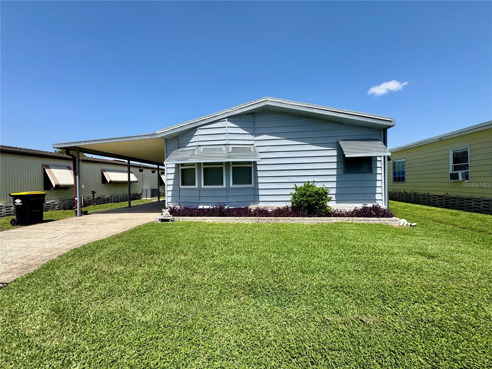 Enjoy peaceful canal-front living in Mariana Park, a 55+ community with a low monthly HOA of only $39/month. This well maintained home is ideal for the boating, fishing, and nature enthusiast, offering an updated, uncovered dock completed in 2024 with canal access leading to Lake Mariana. Spend your mornings feeding turtles in the backyard, relaxing by the water, or walking the circle for daily exercise in this quiet community setting. Inside you'll find the home features updated flooring and a comfortable layout ready for your personal touch, including a workspace and extra side room for all of your creative activities. Also, the roof was replaced at the end of 2025 for added peace of mind. Located in Auburndale near I-4, you’ll have convenient access to Lakeland, Tampa, Orlando, theme parks, airports, beaches, medical facilities, shopping, dining, and more. Affordable water-access living in Central Florida with low HOA fees ready and waiting for you!