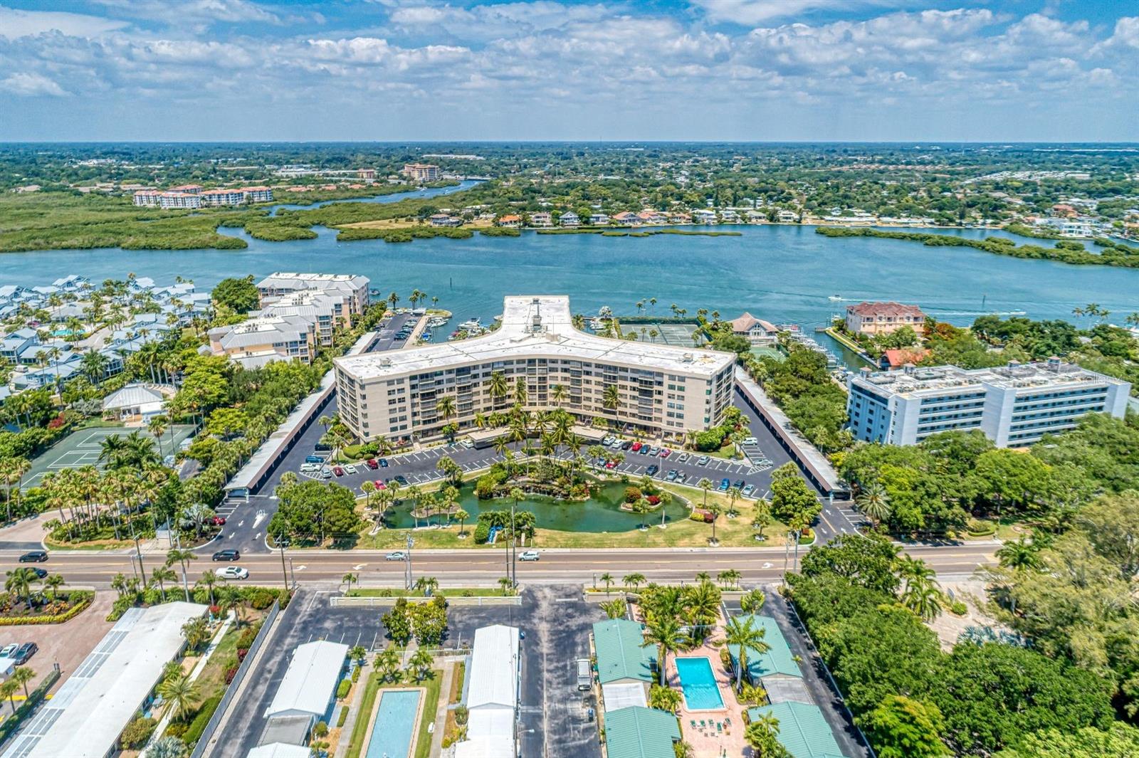 THE VIEW, THE VIEW, Location, Location.  This is IT!  RESORT LIVING UNDER $500,000!  EVERY AMENITY AT YOUR FINGERTIPS! BEAUTIFULLY APPOINTED, IMPRESSIVE ENTRANCE WITH WATERFALL, WALK INTO THE LUXURY APPOINTED HUGE FOYER--TURN KEY INCOME GENERATING VACATION HOME! STUNNINGLY SELECTED AND DESIGNED UNIT OVERLOOKING THE POOL AND VIEW OF INTRACOASTAL WATERWAY---DESIRABLE 2 WEEK RENTAL WHEN YOURE NOT HERE, BLOCK IT OUT WHEN YOU COME TO ENJOY AND RELAX! ON SITE RENTAL OFFICE TAKES CARE OF IT ALL! Experience the ultimate in luxury coastal living within the waterfront resort community of Harbor Towers Yacht & Racquet Club, one of Siesta Key’s most desirable gated waterfront communities. This beautifully updated sunrise-facing 1 BR, 1 bath home offers breathtaking views of the intracoastal waterway, a completely upgraded oasis to provide modern comfort and elegant coastal style with a gorgeous view of the heated pool and outdoor awning for alfresco dining. Being sold turnkey furnished, this third-floor residence is decorated for immediate enjoyment as a full-time home, vacation getaway, or income-producing investment property. The stunningly renovated interior features hurricane-rated windows, a breathtaking quartz kitchen, vinyl plank wood floors and a stunning bathroom accented in gold. The open-concept living and dining area is filled with natural light, creating a bright and welcoming space ideal for relaxing or entertaining.  Included is a washer and dryer, plenty of extra storage space directly across the hall and additional large washers and dryers located on each floor for larger items. Perfect for couples and extended stays, this retreat combines modern coastal finishes, large windows, and resort-style amenities just minutes from world-famous Siesta Key Beach and Siesta Key Village. For boating enthusiasts, you’ll find a beautiful marina with boat slips, as available, through the association.
This property offers excellent income potential. Two-week minimum rentals are permitted, and owners may utilize the on-site property management office or manage rentals independently.  Residents of Harbor Towers enjoy an exceptional collection of amenities, including:  
*A large marina *Gulf access (no fixed bridges) *Heated swimming pool and shallow wading pool *Three tennis courts *Fully equipped fitness center with new showers and saunas *Clubhouse with social spaces and large kitchen •Outdoor BBQ and kitchen prep area under a beautiful new awning *For boating enthusiasts, boat slips are available through the association plus an ample kayak storage area. 
Whether you're seeking a luxurious full-time residence, seasonal retreat, or income-generating property, Harbor Towers offers the perfect blend of resort living and coastal charm.  Located near shops and restaurants and across the street from the world-famous Siesta Key Beach, don’t miss this rare opportunity to own your piece of paradise on Siesta Key.