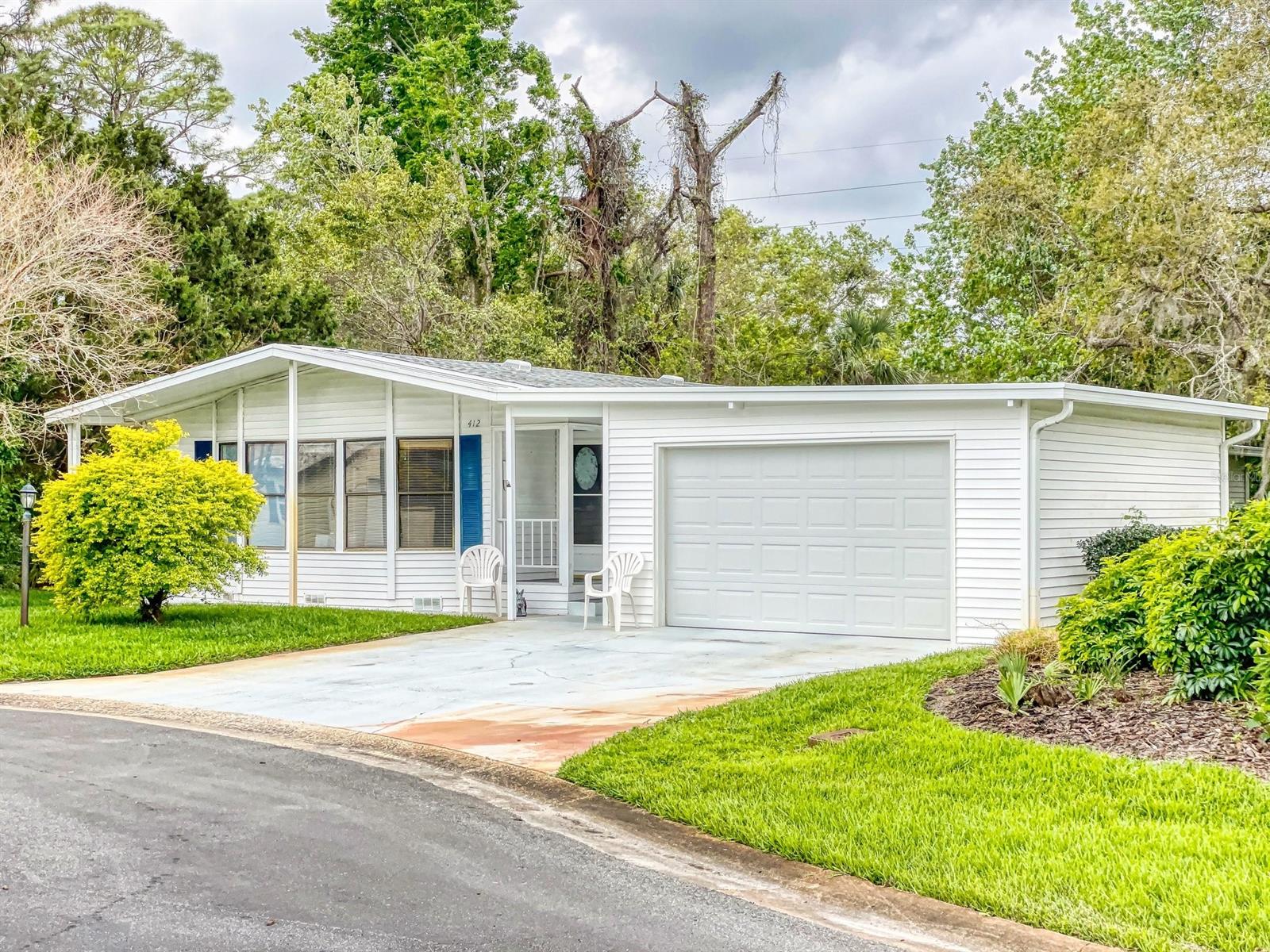 INVESTOR ALERT:  DRASTICALLY REDUCED due to an inspection report.  Price is firm "as is"  Call listing agent for more information - Helen Harvey 386-314-9522.  Lovely and bright  2 bedroom with garage added 2017 (large enough for your car and golf cart).  Enjoy your 17x13  family room with lots of windows - screen room converted to a  beautiful 20x10 glassed Florida room (2016).  Lovely kitchen has built-in counter range, new light fixtures, new dishwasher.  Wet bar for entertaining.  Water softener.  NEW ROOF 2/23, A/C 2015, new hot water heater 3/23, polyethene plumbing changed throughout 3/23.  Covered carport leading to the shed.   Located on a dead-end cul-de-sac street.  Streets are public streets.  Underground utilities.  Platinum cable and fast internet is included in the low HOA dues.  You own the land.  Community is located on the intracoastal with resident boat access.  Storage for one toy (boat or RV) is included with your HOA when available.  Otherwise on a waiting list.  A few of the MANY AMENITIES are: heated pool, screen hot tub,  tennis, pickleball, bocce, shuffleboard, ceramics, chorus, bingo, several different card games, line dancing lessons, fitness room, woodworking shop, Boat and Fish Club, Women's Club and Entertainment committee. ;Water: City