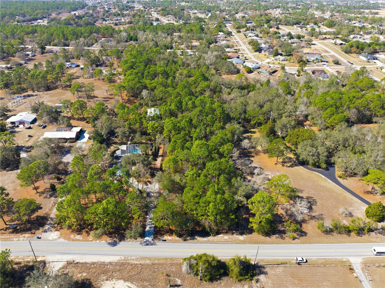 Build your dream home on this beautiful 2.4± acre wooded lot with approximately 732' x 144' dimensions. Zoned AR-2, offering flexibility for residential, agricultural, or hobby farm use. Located on Barclay Ave with paved road frontage, surrounded by established homes yet offering privacy and space. A rare opportunity for acreage living with convenient access to local amenities.