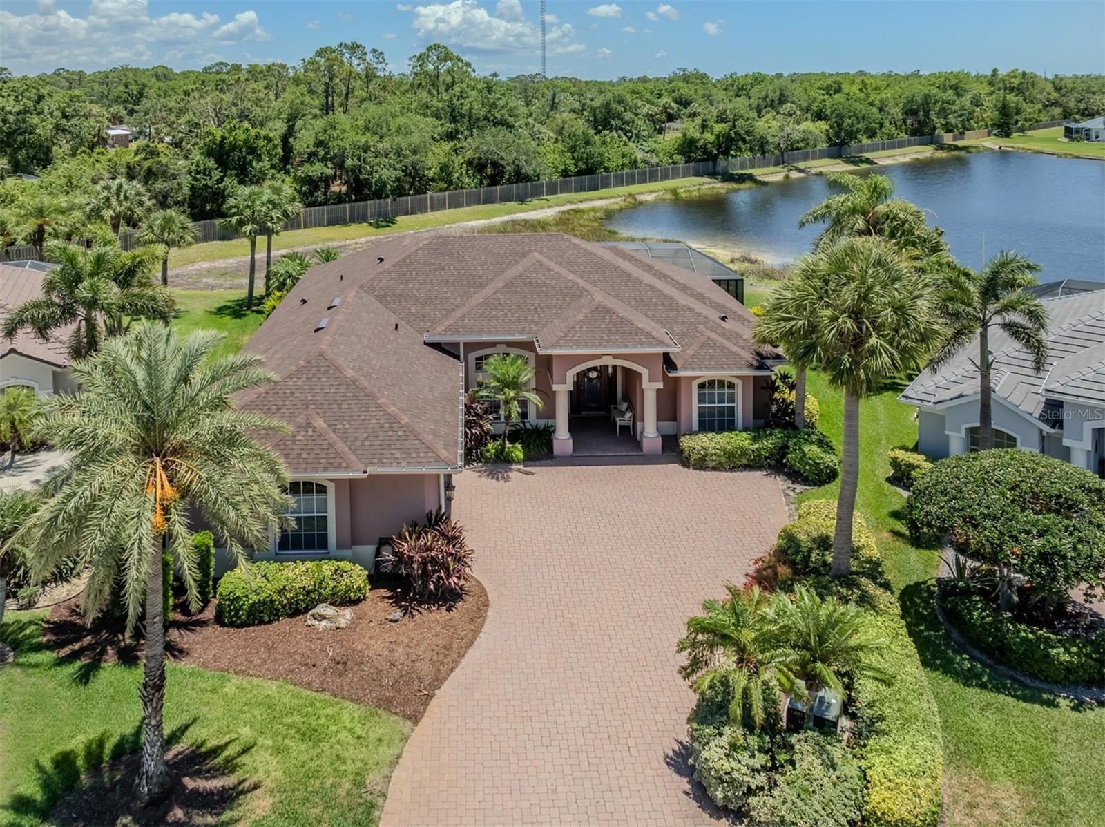 Welcome to your dream home on a beautiful and private lakefront homesite. An immaculate three-bedroom, two-bath solid block residence all custom-designed and built by Caithness Construction. Boasting almost 2,700 square feet of elegant living space, this home will not disappoint. Go inside to a spacious split floor plan, offering privacy and functionality with storage galore. The open concept living and dining areas flow seamlessly into a well-appointed kitchen, ideal for everyday living and hosting guests. Enjoy peace of mind with a new roof and new air conditioner, all redone in 2025, ensuring year-round comfort. Outside, your private pool overlooks the sparkling lake, creating a backyard oasis. Additional highlights include a side entry garage, lush landscaping and an unbeatable location close to the coast yet peacefully tucked away on a quiet lake. This rare combination of space, style and location won't last long. This community is a quaint enclave of homes with sidewalks throughout the neighborhood for nightly walks. Conveniently just minutes from beautiful Gulf beaches, Interstate 75, medical facilities, hospitals, shopping, historic downtown Venice, dining, A-rated schools and more. This home has low HOA fees and no CDD fees. You will appreciate the convenience of this community, close to everything this quaint town has to offer. This residence will not last long, so make your appointment to see this beautiful home today.