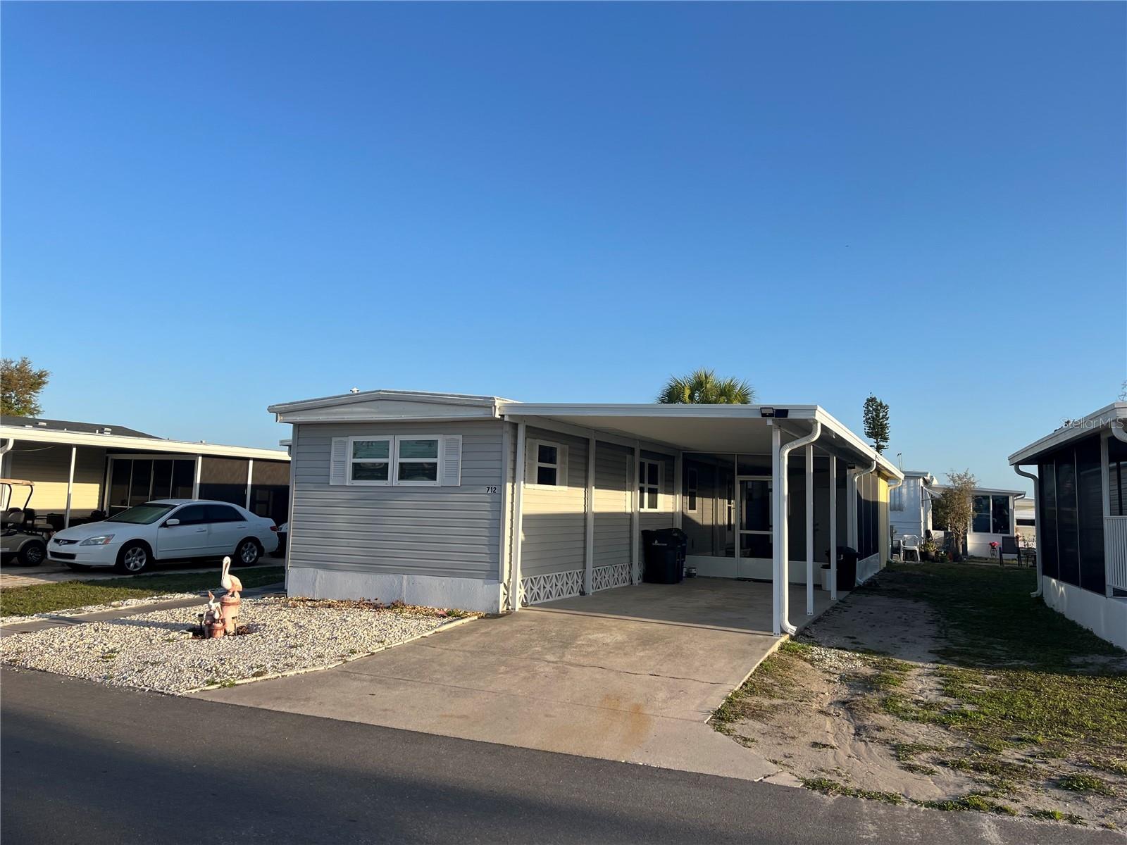 New carport and shed, Newer AC in 2022, Newer windows, membrane roof over, Newer kitchen cabinets, Split bed rooms for added privacy when guests visit, Laminate flooring, Large Screen room in addition to a Florida room. Vinyle siding and added tiedowns gives you everything for added protection. 
Venice Isle is the premier resident owned over 55 Mobile home Park in Venice.  There are close to 1000 homes with the most active residents. There is always something going on for you to do. We have many Park gatherings and first rate shows on site. The Park has every amenity you can imagine. Come take a walk through both of our 2 clubhouses and make yourself at home. The Park has 2 tennis courts, a fitness center, 2 heated pools, 2 hot tubs, saunas, putting greens, shuffleboard, Bocce ball, miniature golf, art rooms, pool room, TV lounges, card rooms, library, horseshoes, ceramic kilns, 2 huge ballrooms, Sunday services and much more!