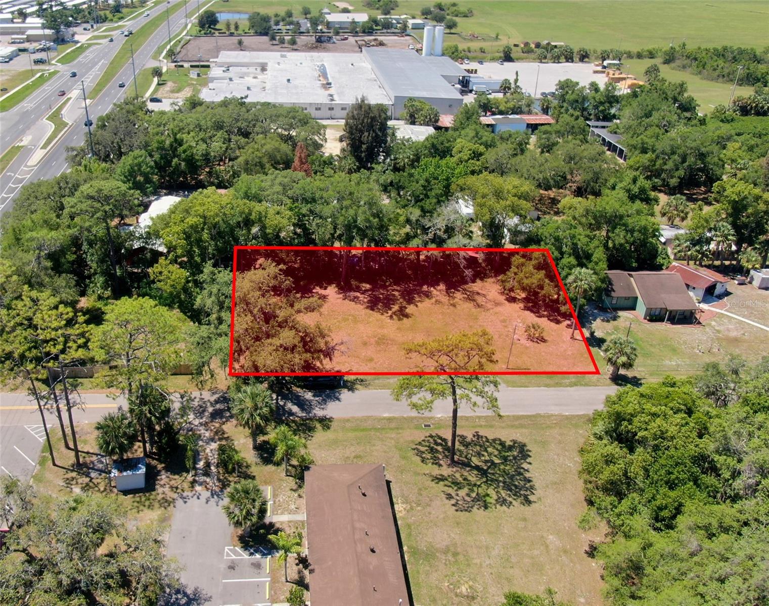 Cleared, Improved & Ready to Build — Exclusive Kevco Homesite in a Growing Corridor! Discover an exceptional opportunity on the Eustis/Umatilla border — a fully cleared, nearly ¼-acre lot tucked just inside a prime corner block off SR-19. This interior homesite offers the perfect blend of quiet surroundings with immediate access to major routes, local conveniences, and the rapidly developing SR-19 corridor.

With NO impact fees and existing improvements on-site, including two wells, a septic system, and power, this property offers a strong head start for your future build. Buyer to verify usability of existing systems with Lake County and appropriate professionals. Zoned R-6, the lot provides flexible residential options, and Lake County offers an easy plan-review process that can even be completed before closing.

Perfectly positioned for lifestyle and convenience, this homesite is just minutes to Historic Downtown Eustis and Downtown Mount Dora, close to waterfront dining on the Harris Chain of Lakes, and offers easy access to boating, fishing, and public lake ramps. Everyday essentials are nearby, including grocery stores, gas stations, and local services. Outdoor enthusiasts will appreciate being a short drive to the Ocala National Forest, known for its natural springs, scenic trails, and abundant recreation.

Best of all — Kevco Builders is the exclusive builder for this homesite, giving you access to Lake County’s most trusted and award-winning custom builder. Whether you’re envisioning a cozy retreat, a modern farmhouse, or a fully custom design, Kevco can tailor a home to your lifestyle, budget, and long-term goals.