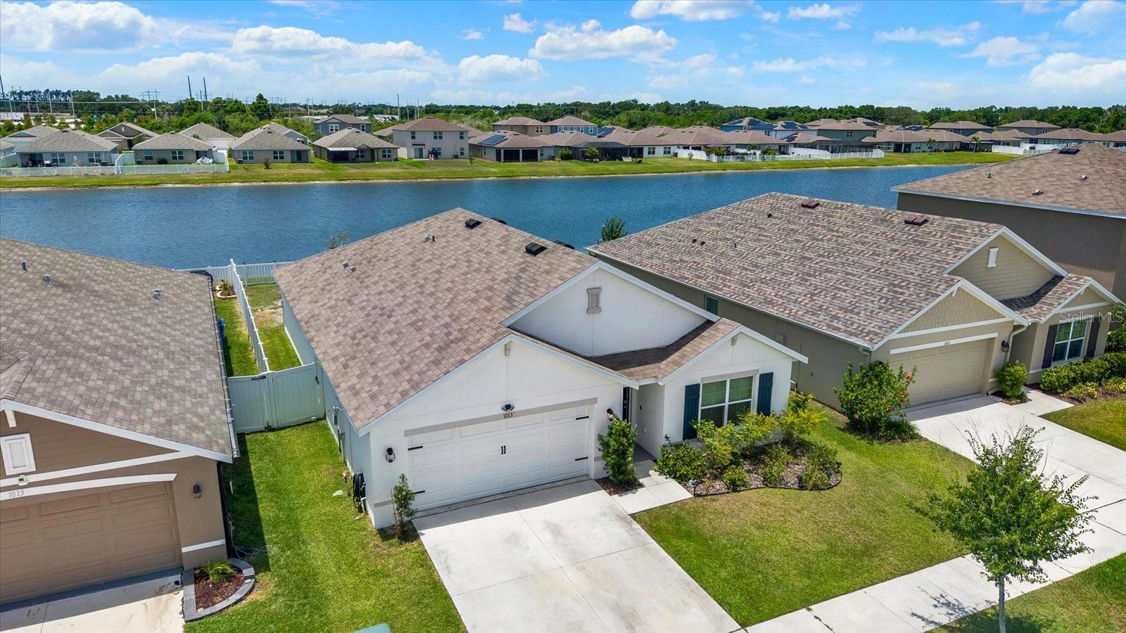 The Difference Is in the View! Skip the construction timeline and start enjoying the view from day one. Set on one of the community's desirable waterfront homesites, this 4 bedroom, 3 bathroom home offers something buyers are struggling to find in today's market: a newer home with the upgrades already completed and a backyard you'll actually want to spend time in.The fully fenced yard, screened lanai, and extended paver patio create the perfect setting for morning coffee overlooking the water, weekend gatherings, or simply unwinding after a long day. These improvements are already in place, allowing you to enjoy the home from the moment you move in. Inside, you'll find a thoughtfully designed layout featuring granite countertops, stainless steel appliances, smart home technology, decorative accent walls, and an open living space designed for everyday comfort and entertaining. The split bedroom floor plan provides privacy while maintaining a functional flow throughout the home. Even better, all kitchen appliances are included, along with the washer and dryer, making your move that much easier. Brookside residents enjoy a community pool, clubhouse, playground, basketball court, and dog park while being conveniently located near I 75, shopping, dining, medical facilities, and everyday conveniences. If you've been considering new construction, take a closer look. Why wait months for completion when you can enjoy the water view, outdoor living space, included appliances, and upgrades today? Homes with waterfront views, completed outdoor improvements, and this level of value rarely become available. Schedule your private showing and experience the view for yourself.