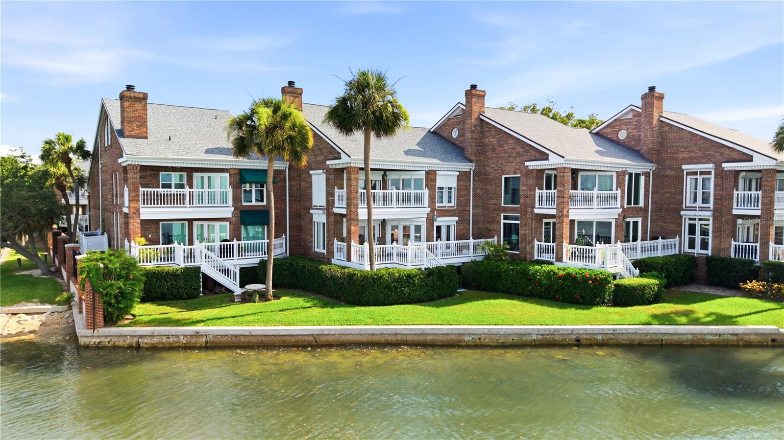 Rarely available and brimming with potential, this exceptional WATERFRONT gated townhome offers some of the most breathtaking panoramic views of Tampa Bay. Enjoy sweeping 180-degree water vistas that stretch as far as the eye can see, creating a truly spectacular backdrop for everyday living. Enjoy the views framed by 3 SETS of French doors from your family room, dining room and kitchen. Abundant natural lighting, vaulted ceilings, elevator to all levels, private balconies from each bedroom, bonus office space on upper level that could be converted to a playroom, media room, or another bedroom for multi generational living, and an amazing covered back deck spanning the width of the residence are just a few of the special features for you to enjoy. 
Positioned in a highly sought-after location, this residence presents a rare opportunity to personalize a property with incredible views.  Imagine designing your dream home while taking full advantage of the mesmerizing bay views from nearly every angle.
Located directly across from the horse stables and just a short stroll to the renowned Tampa Yacht Club, this prime location offers the perfect blend of waterfront living, recreation, and convenience. Whether you’re seeking a full-time residence or a lock-and-leave retreat, opportunities like this are few and far between.
Bring your vision and unlock the extraordinary potential of this special waterfront property.