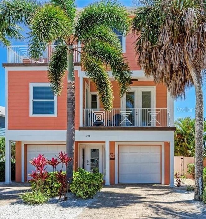 Your dream view, just got a dream price!  Luxury 5 Bedroom Waterfront + Dock | 3-Min Walk to Beach -Exceptional waterfront retreat perfectly positioned in the heart of Anna Maria Island. Just a three-minute stroll to the soft sugar sands of Manatee Beach, this stunning five-bedroom, three-and-a-half-bath residence delivers coastal luxury at every turn—complete with a private dock with ladder where manatees often glide by, a heated pool and spa, and a show-stopping rooftop deck with Gulf and Bay views.
Designed for unforgettable gatherings, Coral Castle seamlessly blends upscale comfort with relaxed island charm! Outdoor Living at Its Finest, the rooftop deck is the crown jewel of Coral Castle—offering breathtaking sunrise and sunset views over both the Gulf and Bay. Start your mornings with coffee and ocean breezes or unwind in the evening with a cocktail as the sky glows in brilliant island hues.
The tropical backyard is a private sanctuary featuring a heated pool, spa, lounge seating, and outdoor grill, perfect for post-beach relaxation or entertaining under the stars. From the private dock, enjoy peaceful water views—and keep watch for friendly manatees passing by, an unforgettable hallmark of island living.

Stylish Interiors Made for Comfort-Step inside to a bright, open-concept living space filled with natural light and coastal elegance. The living room offers plush seating, a flat-screen TV, and sliding glass doors that open directly to the outdoor patio—blurring the line between indoor and outdoor living.
The chef-inspired kitchen is fully equipped with stainless steel appliances, generous counter space, and a wine fridge, making meal prep effortless. Gather inside at the dining table or dine alfresco beneath the covered patio for a true island experience.
Sleep in Luxury-
Primary Suite: King bed, private balcony, vaulted shiplap ceiling, walk-in closet, spa-style ensuite with soaking tub and walk-in shower; Second Bedroom: King bed, Jack-and-Jill bathroom with walk-in shower; Third Bedroom: King bed, Jack-and-Jill bathroom with walk-in shower; Fourth Bedroom: Full bed, Jack-and-Jill bathroom with shower/tub combo; and Fifth Bedroom: Full bed, Jack-and-Jill bathroom with shower/tub combo.
Prime Island Location- Enjoy peaceful mornings fishing from the dock or take a short drive to Pine Avenue and Bridge Street, where you’ll discover charming boutiques, local dining, and island favorites. Whether your days are spent boating, lounging by the pool, or soaking in rooftop views, Coral Castle delivers the perfect balance of relaxation and adventure. Every detail is designed to create lasting memories—from manatee sightings to sunset cocktails on the rooftop. This is more than a stay—it’s a true Anna Maria Island experience.
Currently operating as a vacation rental with solid history and a strong start to 2026—ideal personal-use + income opportunity.