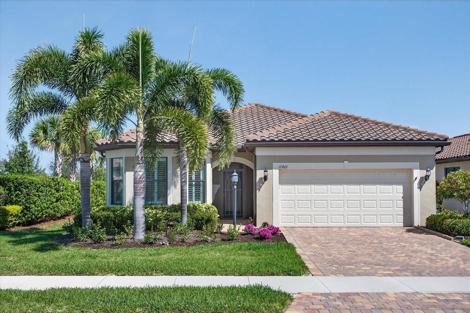 Embrace the Florida Lifestyle in This Beautiful Mystique Model. Experience the charm and
comfort of Florida living in this captivating Mystique Model situated on a water lot, offering 2
bedrooms, 2 bathrooms, and a versatile den within a bright and inviting 1,930 sq ft open
floor plan. Built in 2021, this beautifully maintained home is light, airy, and welcoming,
featuring neutral ceramic tile flooring in the main living areas and plush carpeting in the
bedrooms, creating a warm and elegant atmosphere. Ideally located in the highly sought-
after Del Webb 55+ community, this residence places you in the heart of Lakewood Ranch,
the nation’s premier multi-generational master-planned community—offering an exceptional
lifestyle with world-class amenities. Designed with both entertaining and everyday comfort in
mind, this home is filled with thoughtful upgrades that enhance both style and functionality.
Highlights include upgraded landscaping with decorative edging, garage shelves, an
insulated garage door, hurricane impact glass for peace of mind, a front door security
screen enclosure, and a decorative glass front door insert. Additional upgrades include
custom closet systems throughout—including the pantry—designer lighting fixtures and
ceiling fans, upgraded bathroom mirrors, tray ceilings in the owner’s suite and gathering
room, and a rain-style showerhead in the owner’s bath. At the heart of the home, the
beautifully upgraded kitchen will delight any culinary enthusiast. It features 42” light
cabinetry, granite countertops, a 5-burner gas cooktop, premium KitchenAid appliances,
and an elegant stainless-steel canopy hood—combining both beauty and functionality. The
owner’s suite serves as a relaxing retreat with water views, a tray ceiling, spacious layout,
and a luxurious ensuite featuring dual granite vanities and an oversized walk-in shower. The
flexible den provides endless possibilities—perfect as a home office, gym, craft room, or
hobby space tailored to your lifestyle. The gathering room, also accented with a tray ceiling,
flows effortlessly to the extended lanai where you can relax in the Florida sunshine or enjoy
the water view! The 2-car garage offers ample space for storage, a workshop, or even a golf
cart, and includes shelving and an insulated door for added convenience. Additional
enhancements include plantation shutters, blinds and draperies, an HVAC blue light
purification system, and recently cleaned and sealed pavers. This well-maintained home is
ready to welcome you to a lifestyle of comfort, beauty, and resort-style living. Schedule your
private showing today.