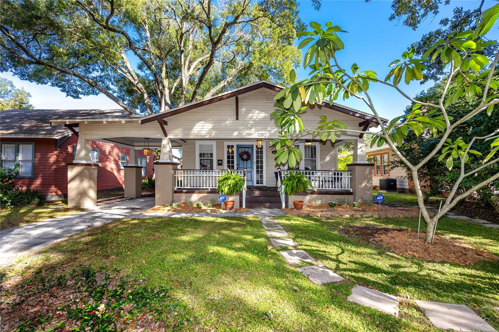 Explore the Charms of Historic Hampton Terrace in Seminole Heights! Experience contemporary comfort in this beautifully updated 1923 Bungalow. This timeless gem seamlessly blends original features with contemporary upgrades. As you enter, you're greeted by the inviting brick fireplace, well-maintained hardwood oak floors, and elegant glass doorknobs, all while enjoying the convenience of a fully updated kitchen featuring sleek quartzite countertops, newer appliances, and modern washer/dryer units. True to its bungalow style, the layout effortlessly flows from the front of the home to the expansive backyard. There, a generous deck and spacious yard beckon, creating the perfect setting for gatherings and outdoor enjoyment. Adding to the appeal of this property is the recently updated detached structure. With brand-new vinyl flooring and a window AC unit, it's a versatile space with ample closet storage, making it an excellent extension of your living space. Centrally located, this home provides easy access to downtown, Armature Works, I-275, and the vibrant culinary and brewery scene of the area. Schedule a tour today to truly experience what Tampa has to offer and make this charming house your next home.