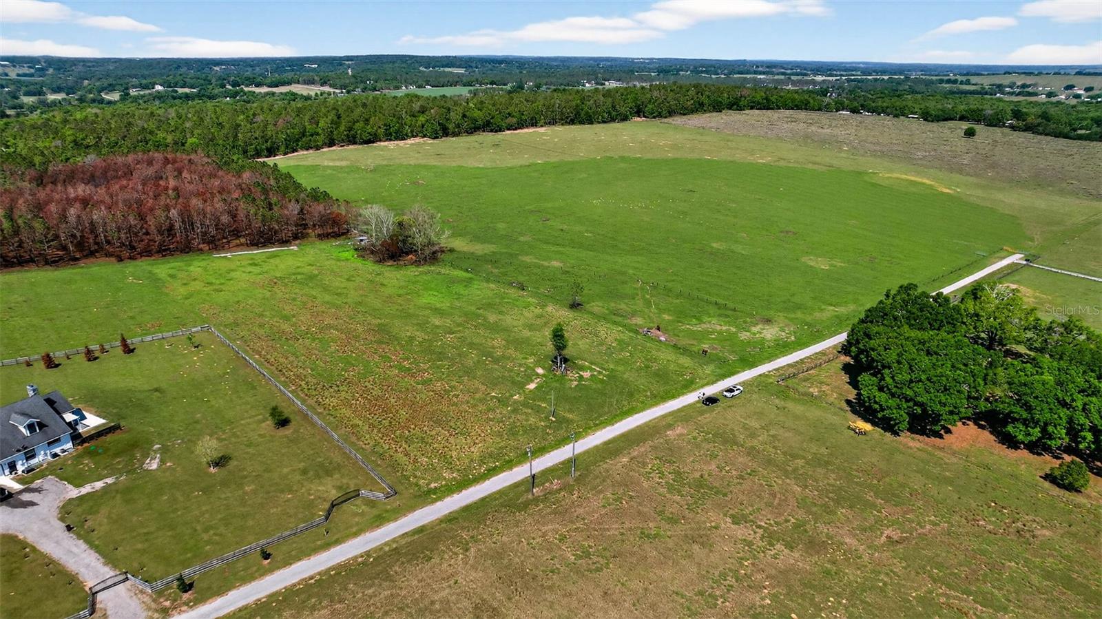 Nestled within the scenic rolling hills of the Blanton area in Dade City, this exceptional 25-acre parcel offers the perfect opportunity to create your dream property. With elevations ranging from approximately 155 to 200 feet above sea level, this property is situated in Flood Zone X—providing peace of mind as high and dry land.

Surrounded by natural beauty and wide-open spaces, this land is ideal for those seeking privacy, tranquility, and the freedom to build exactly what they envision. Accessed via Hilltop Horizons Pl., a privately maintained asphalt dead-end road, you’ll enjoy both seclusion and ease of access.

Whether you’re dreaming of a custom-built estate, a private equestrian retreat, or a working farm, this versatile property provides endless possibilities. Bring your horses, livestock, and outdoor lifestyle—there’s plenty of room to make it your own.

With power already in place and a well established on the property, much of the groundwork has been started for you—making your building process that much smoother. The gently rolling terrain adds character and charm, while offering multiple potential homesites to take full advantage of the surrounding views.

Enjoy the peaceful country setting while still being just a short drive to I-75, downtown Dade City, shopping, dining, and everyday conveniences.

If you’ve been searching for acreage in a truly picturesque setting, this is your chance to bring your vision to life.