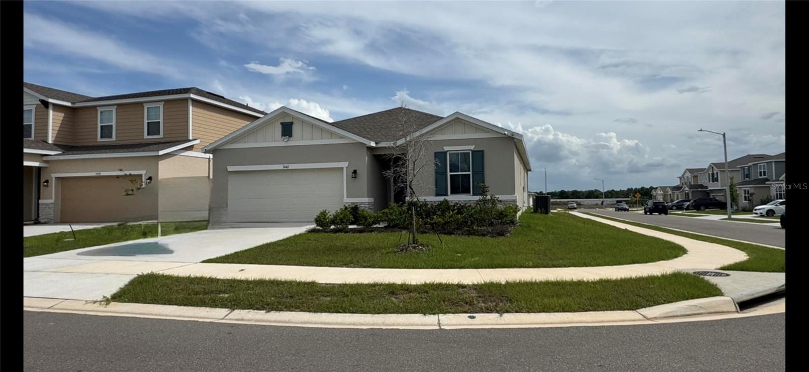 Welcome to this stunning better-than-new corner-lot home in the highly desirable Scenic Terrace community! Less than 2 years old and just a short walk from the community pool & mailbox pavilion, this beautifully upgraded 4-bedroom, 3-bathroom home is truly move-in ready.
Designed for both everyday living and entertaining, the spacious open-concept layout seamlessly connects the dining area, gourmet kitchen, and great room. Dual sliding glass doors open to the covered, screened lanai, creating the perfect indoor-outdoor living space. Ceiling fans installed in all bedrooms, the great room, and the lanai for year-round comfort.
The home's attractive curb appeal is enhanced by decorative stone accents and a covered front entry. Inside, the thoughtfully designed kitchen features abundant 42-inch cabinetry, quartz countertops, a stylish tile backsplash, a large prep-and-serve center island, a walk-in pantry, and an open dining area. Premium stainless-steel LG and Bosch appliances, including a French-door refrigerator with ice maker, complete this impressive space.
Privately situated at the rear of the home, the spacious primary suite has a large walk-in closet, a sleek retractable ceiling fan, and a luxurious en-suite bath featuring a double vanity with quartz countertops, a walk-in glass-enclosed shower with tile surround, and a separate garden tub.
Three additional bedrooms provide plenty of flexibility, including a guest suite with its own private full bath, while the remaining two bedrooms share a well-appointed hall bath. A centrally located laundry room includes the washer and dryer. Beautiful 7-inch by 22-inch wood-look ceramic plank tile flooring extends throughout the entryway, dining area, kitchen, great room, bathrooms, primary suite, and guest bedroom, creating a cohesive and elegant look. Every bathroom is equipped with a bidet for added comfort and convenience. Window blinds are included throughout the home, including custom blinds for the sliding glass doors. Additional conveniences include an automatic irrigation system, an attached two-car garage, and basic internet service included through the HOA.
Since purchasing the home, the owners have invested in numerous valuable upgrades, including upgraded stainless-steel LG & Bosch kitchen appliances, Kitchen back splash, lighting fixtures throughout, additional ceiling fans, a whole-home water filtration system, replacement of the primary suite and guest bedroom carpeting with matching ceramic tile flooring, a screened lanai, all bathrooms have an attached bidet, a Ring Video Doorbell with two-way communication, and a professionally monitored SimpliSafe 24/7 home security system.
Scenic Terrace is ideally located adjacent to Scenic Terrace Elementary and Middle Schools,  . Everyday shopping is just minutes away, with Haines City Mall and Publix approximately eight minutes from home. Outdoor recreation is abundant at nearby Lake Eva Community Park, while Walt Disney World is only about 30 miles away. Access to Highway 27 and Interstate 4 makes commuting and day trips a breeze. Residents also enjoy exceptional community amenities, including a resort-style swimming pool, cabana, dog park, and playground. This beautifully upgraded home has modern style, premium finishes, thoughtful upgrades, and an unbeatable location-all without the wait or added expense of new construction.