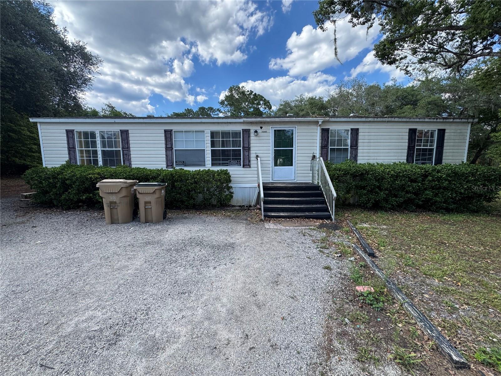 This property offers a great opportunity to enjoy peaceful country living with room to make it your own! This semi-updated mobile home features recent improvements while still leaving potential for additional cosmetic updates and personal touches. The spacious lot provides plenty of room for boats, RVs, work equipment, animals, gardening, or future expansion. Enjoy the privacy and flexibility of rural living while still being conveniently located near Eustis, Mount Dora, shopping, dining, and major roadways. Whether you’re looking for a primary residence, investment opportunity, or a property with land and potential, this one is worth a look!