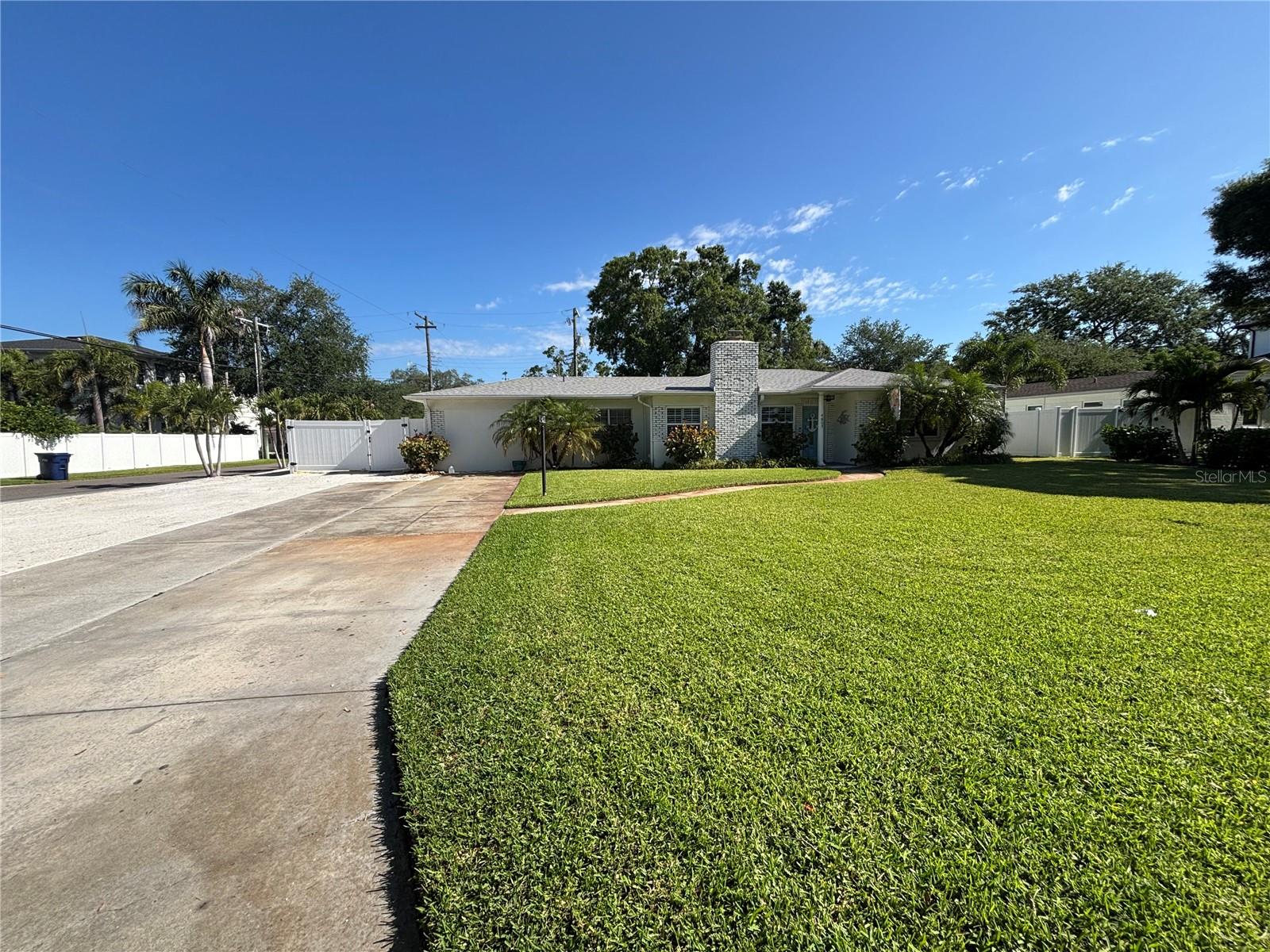 Welcome to this beautifully designed and decorated South Tampa home that has been updated with attention to every detail.  Located on an oversized 85’ X 110’ corner lot on the southern border of Sunset Park subdivision.  
This private compound has lots of bells and whistles not found on many South Tampa properties including a large 24’ X 26’ detached garage with a 12’ X 16’ steel roll up door providing very flexible space for an incredible “Entertainment Cave”, RV storage, golf cart and/or classic antique car storage. In addition, there are two detached sheds conveniently tucked away in the back yard to provide lawn equipment storage or a great space for a workshop/hobby area in one shed and a possible private office in the other as previously used. 
Don’t let the square footage of this completely renovated 3-bedroom, 2-bathroom move-in ready home fool you into thinking it may not have everything you need. The interior features a desirable split-bedroom floor plan with an additional sitting room/office perfect for working from home or that can be used as extra living space.  The primary bedroom has cathedral ceilings and two built-in closets. An open-concept kitchen flows seamlessly into the well-lit family/living room accented by the wood burning fireplace. Separate dining room with double French doors opening to a large, tiled patio with plenty of room for lots of outdoor furniture for parties and entertaining. The well decorated hall bathroom includes extra-long vanity with quartz counter tops, oversized shower with glass doors and tiled walls accented with glass subway tiles all brightly lit with pendant lighting.
The upgraded interior features include laminate wood and ceramic tile flooring, custom made burnt wood wall shelves in dining room, shaker-style cabinets with granite counter tops and stainless-steel appliances finish off the centrally located kitchen including an eat-in bar area with pendant lighting.
The spacious back yard incorporates all the out-buildings mentioned and has plenty of additional space for large boat storage, an outdoor bar, garden area with shade trees and the large patio all accessible through a double-wide gate along with the double French doors from dining room. 
The major updates on this home include a new architectural design shingle roof, new HVAC system and double paned insulated windows that provide lots of natural light throughout the home.
You have to see it to believe it, so don’t dare miss this opportunity to have all these exceptional features listed above to yourself, right here in beautiful South Tampa.
