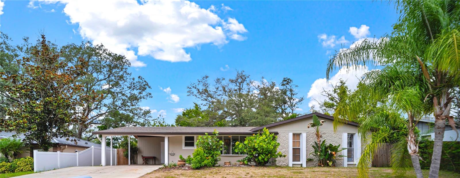 This home hits all the right notes. Stunning 2025-2026 Renovation, it's not in a Flood Zone, Zero HOA fees, and it has insurance friendly upgrades! Welcome to your turn-key Terrace Park oasis, perfectly positioned just 5 minutes from USF, Moffitt Cancer Center, VA hospitals, and a short drive to I-275, (Tampa’s lifeline to downtown experiences). This three-bedroom, one-bathroom, single-family home lives larger than its size suggests. Beautifully updated for an optimum living experience, over $50k in recent improvements have been completed. Whether you desire convenience, privacy or long-term appreciation, this home is for you. Step inside to an interior that feels clean and bright with high ceilings, tons of natural light, and a neutral color palette. The gorgeously renovated kitchen (2025–2026) features new cabinetry, elegant wood countertops, a striking new backsplash, plus a suite of premium appliances; including a new stove, microwave, and dishwasher. The fully renovated bathroom (2025) includes a new bathtub, a modern shower, a sleek vanity, and new flooring. Three naturally sunlit bedrooms are spacious, serving perfectly as a peaceful retreat or as a home office space for the modern professional. In Florida, your everyday life extends beyond the interior walls. This property offers a covered lanai that is newly screened and ready for evening gatherings or daytime relaxation. The expansive lot (81 x 100), with fully fenced backyard is your private tropical retreat shaded by mature trees. And includes fruit trees; avocado tree, starfruit tree and a newly planted lime tree. You will love that it has plenty of space for pets, a garden, or even a pool. This home provides peace of mind with the major mechanicals completely checked off your list: HVAC (2026), Water Heater (2025), Electrical Panel with copper wiring (2024), and Roof (2024). Hurricane preparedness has also be addressed with the installation of hurricane-rated patio door and several storm-rated windows (2025). In a housing market where it is hard to find an affordable, comfortable, charmingly updated home in an unbeatable location, this home needs to be on your list. Make your appointment for a private tour today to make this home yours!