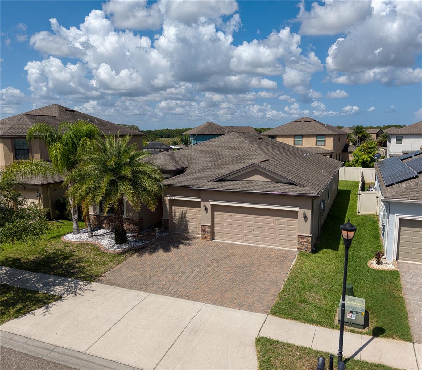 Welcome to this stunning home in the sought-after community of Belmont! This beautifully designed 4-bedroom, 3-bath residence with a 3-car garage showcases a spectacular floor plan.
Step inside to a bright, open-concept living space anchored by an amazing gourmet kitchen featuring 42" cabinets, granite countertops, a spacious island, and all stainless steel appliances. With generous counter space and room for a table, the cook of the house stays right in the heart of the action, seamlessly connected to the living area. A split-bedroom design places one bedroom and a full bath at the front of the home—ideal for guests or a private office—while the remaining three bedrooms enjoy privacy in the rear.
This home is built for efficiency and savings. With fully owned solar panels (no lease to assume—the energy savings transfer directly to you) plus a top-tier energy rating and a host of energy-saving features, you can look forward to remarkably low electric bills. Additional upgrades throughout add even more value and style.
Ideally located right on US-301, Belmont offers unbeatable convenience to shopping, dining, and quick access to I-75 for an easy commute. You'll fall in love the moment you walk through the door—schedule your showing today!