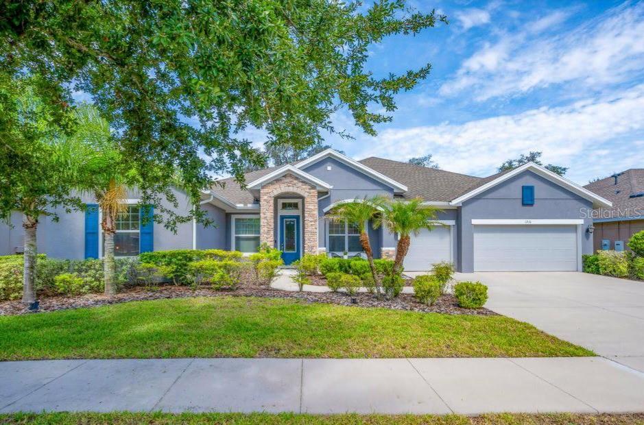 Welcome home to Brooker Reserve—where thoughtful design, luxury finishes, and exceptional community living come together. A quiet GATED community just minutes from the heart of Brandon. Built by David Weekley Homes in 2016, this stunning sprawling One Story Waverly floor plan offers over 3,470 square feet of thoughtfully designed living space with 4 bedrooms, 3 bathrooms, and a 3-car garage, perfectly blending elegance, comfort, and functionality for today's growing family. Step through the front door into a grand foyer accented with beautiful crown molding, setting the tone for the home's refined design. Just off the entry, a spacious study provides the ideal setting for a home office, library, or optional guest space. Across the foyer, the formal dining room offers an elegant space for hosting holidays, dinner parties, and special occasions. At the heart of the home, the expansive great room showcases David Weekley's signature "sightline" design, creating an open, airy feel and allowing natural light to flow throughout the living spaces. Large windows frame views of the backyard while seamlessly connecting the living, dining, and kitchen areas. The chef-inspired eat-in kitchen is sure to impress, featuring white 42-inch cabinetry with crown molding, granite countertops, a stylish tile backsplash, stainless steel appliances with a range hood, and an oversized center island with breakfast bar seating—perfect for gathering with family and friends. Privately situated at the rear of the home, the luxurious owner's retreat serves as a peaceful escape. Highlights include an elegant tray ceiling, plantation shutters, a comfortable sitting area, a spacious walk-in closet, and a spa-like en suite bath featuring dual vanities, a large walk-in shower, and a relaxing garden tub. The thoughtfully designed split-bedroom layout includes two secondary bedrooms connected by a shared retreat space, ideal for a playroom, media area, or homework station. A private guest suite at the front of the home offers visitors their own dedicated bathroom and comfortable accommodations. Additional features include a spacious utility room that makes laundry day effortless and a covered rear patio that's perfect for grilling, outdoor dining, and year-round entertaining. Residents of Brooker Reserve enjoy the charm of a small, quiet community of only 77 homes, complete with two dog parks, walking trails, and a playground, all while being conveniently located near top-rated schools, shopping, dining, and everything the Brandon area has to offer.