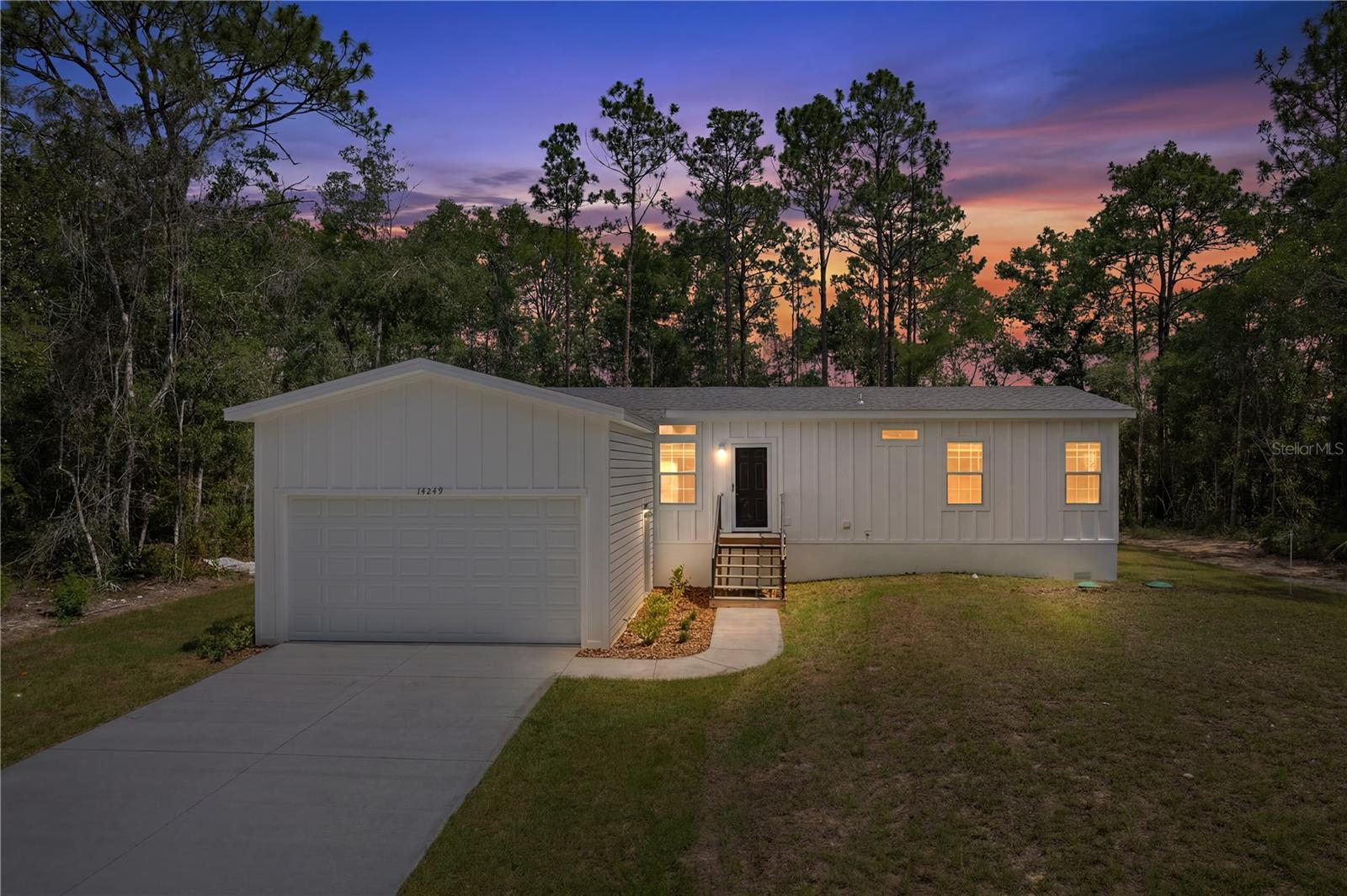 Be the first to call this beautiful brand-new modular home your own! Situated on a spacious (just under) half-acre lot, this 3-bedroom, 2-bathroom home offers the perfect blend of modern comfort and country charm. This home features a bright and inviting living area and a well-appointed kitchen with quartz countertops, ample cabinetry and workspace. A two-car garage provides plenty of room for vehicles, storage, or hobbies. One of the property’s standout features is its peaceful setting. Most surrounding lots on the road are currently non-buildable, creating a sense of seclusion and privacy rarely found in today’s market. Enjoy the freedom and space of this property while still being conveniently located near shopping, dining, and everyday amenities. Move-in ready and waiting for its new owners!