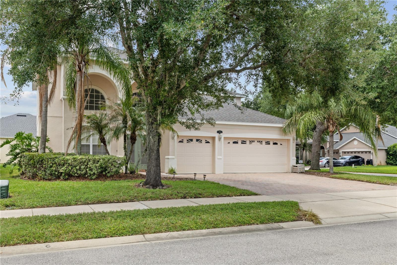 Welcome to Kays Landing, a desirable gated community in Sanford offering exceptional amenities including a community pool and playground. This spacious 4-bedroom, 3.5-bath home boasts a 2022 roof and 3,387 square feet of living space. The primary suite is on the first floor, while upstairs offers three bedrooms plus a bonus room. The kitchen features Corian countertops and overlooks the living areas. Enjoy an extended screened lanai, perfect for relaxing outdoors, and a 3-car garage for added convenience. This home is close to shopping, dining, and major highways—your ideal Florida living awaits!