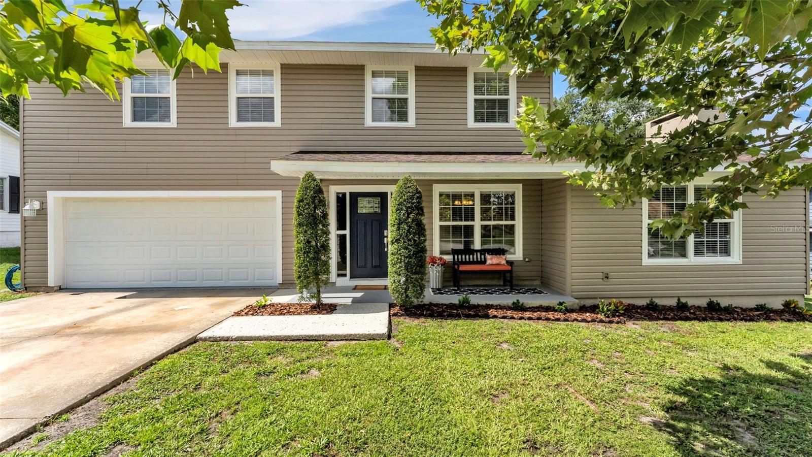 Welcome home to this beautifully updated 3-bedroom, 2.5-bathroom pool home with a dedicated office, ideally situated in desirable South Lakeland with NO HOA. Offering a blend of modern updates and functional living spaces, this move-in-ready home is ready for its next owners. Inside, you'll find new laminate flooring throughout along with numerous recent improvements, including newer exterior siding, double-hung windows, a roof replaced in 2019, HVAC in 2020, and a brand-new pool liner. The spacious living room serves as the centerpiece of the home, featuring a cozy built-in fireplace and plenty of room for gathering with family and friends. The renovated kitchen is designed for both everyday living and entertaining, showcasing quartz countertops, stainless steel appliances, stylish backsplash, new cabinetry, and a separate dining area with beautiful views of the backyard and pool. The first floor also includes a separate space for an office, ideal for working from home, along with a convenient half bathroom. Upstairs, the primary suite offers a private ensuite bathroom with a tub and shower combination. Two additional bedrooms are thoughtfully positioned across the hall and share a full guest bathroom. Outdoor living is just as impressive with a screened-in lanai overlooking the fenced backyard. Whether you're cooling off in the sparkling inground pool, relaxing around the built-in fire pit on the paver patio, or enjoying your morning coffee, this backyard is designed to be enjoyed year-round. Conveniently located just minutes from restaurants, shopping, the new Orlando Health Hospital, and the Polk Parkway, you'll enjoy quick access to both Tampa and Orlando while still experiencing everything South Lakeland has to offer.