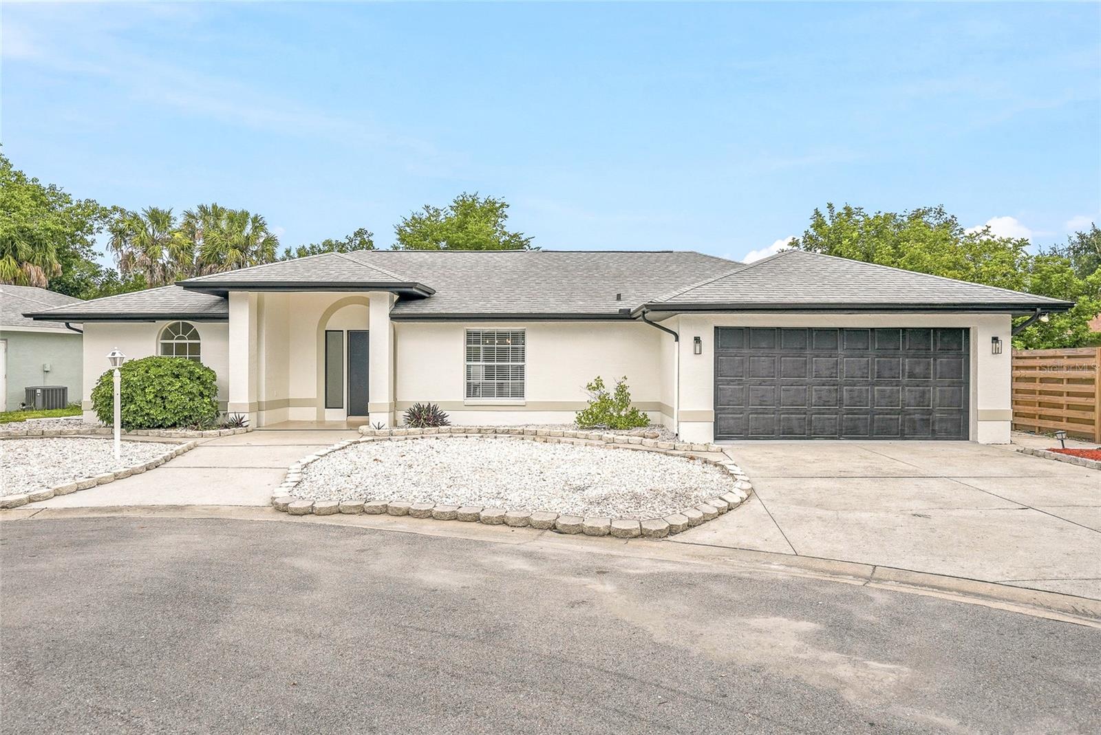 Welcome to this beautifully renovated 3-bedroom, 2-bathroom block POOL home that perfectly blends modern design with everyday comfort. Every inch of this home has been thoughtfully updated with custom finishes, designer details, and quality craftsmanship, creating a space that truly stands out from the moment you walk through the door. Tucked away on a quiet cul-de-sac, the home offers charming curb appeal, a brand-new shingle roof, rain gutters, and a spacious two-car garage. Inside, soaring vaulted ceilings and an open floor plan create a bright, inviting atmosphere that's perfect for both everyday living and entertaining. The kitchen is truly the heart of the home, showcasing a stunning waterfall island with under-island LED lighting, convenient pop-up outlets, a pot filler, all-new appliances, a sleek range hood, and an abundance of soft-close cabinetry that provides exceptional storage without sacrificing style.

The thoughtfully designed split floor plan offers privacy for the spacious primary suite, complete with a walk-in closet featuring a custom organization system and a beautifully renovated en suite bathroom filled with unique designer touches, LED lighting, and an impressive walk-in shower with dual rain shower heads. The guest bathroom has also been completely updated, and every closet throughout the home has been upgraded with custom built-in storage systems. An indoor laundry room, complete with the washer and dryer, adds even more everyday convenience. Sliding glass doors open to an incredible backyard designed for year-round Florida living. Relax in the screened-in pool and attached jacuzzi, entertain with the outdoor kitchen, or unwind in the additional fully enclosed patio that provides even more flexible living space while overlooking the pool. Major updates include a 2020 AC and a 2021 water heater, giving you peace of mind for years to come.

Located in one of northwest Bradenton's most desirable areas, you'll enjoy easy access to the beautiful beaches of Anna Maria Island, Robinson Preserve, Palma Sola Bay, GT Bray Park, shopping, dining, and top-rated schools, all while enjoying the quiet charm of an established neighborhood. This is a home where exceptional design meets everyday livability, creating a space that's as memorable as it is functional.
