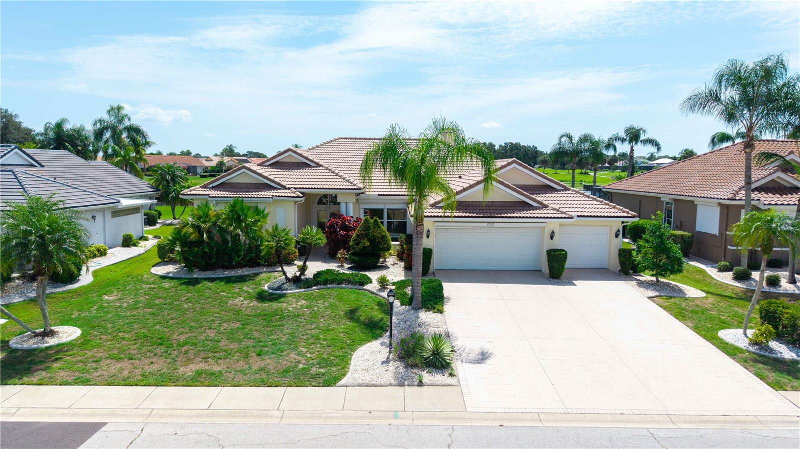 Welcome to this stunning executive-style pool home located in the highly desirable 55+ community of Sun City Center. Offering 3 bedrooms, 3 full bathrooms, and over 2,300 square feet of thoughtfully designed living space, this exceptional residence combines elegance, comfort, and breathtaking water views. From the moment you step through the front door, you'll be captivated by the expansive view of the sparkling pool, tranquil spa, and peaceful pond beyond, with a wall of french doors that immediately draws your eye outdoors. Designed with an ideal split-bedroom floor plan, the home features spacious formal living and dining rooms along with an open kitchen and family room, creating the perfect balance of entertaining and everyday living. The oversized primary suite is a true retreat, complete with two generous walk-in closets and a luxurious ensuite bath featuring dual vanities, a relaxing soaking tub, and a separate walk-in shower. Guests will appreciate the privacy of the secondary bedrooms, while the third full bath is conveniently located off the pool deck, making it the perfect pool bath.
The heart of the home is the spacious kitchen, offering abundant cabinetry, expansive counter space, and a center island perfect for meal preparation or gathering with family and friends. The adjoining family room showcases soaring ceilings and a cozy wood-burning fireplace, creating an inviting atmosphere year-round. Architectural details throughout the home include impressive 10-foot ceilings, with approximately 12-foot ceilings in the main living, dining, and family rooms, adding volume and an elegant, open feel. Five sets of French doors seamlessly connect the interior living spaces to the outdoor oasis. Step outside to your private screened lanai featuring beautiful paver decking, a large covered entertaining area, and a gorgeous pool with an elevated spa that gently spills into the pool below. Whether enjoying your morning coffee overlooking the pond or hosting friends for an evening gathering, this outdoor space is truly exceptional. Additional premium features include a durable tile roof  installed 2025! And complete electric storm shutters protecting every window and exterior door, providing both convenience and peace of mind. Living in Sun City Center means enjoying one of Florida's premier active adult communities, where residents have access to an incredible lifestyle featuring multiple clubhouses, state-of-the-art fitness centers, indoor and outdoor pools, championship golf courses, pickleball and tennis courts, arts and crafts studios, hundreds of clubs and organizations, and a full calendar of social events and entertainment. The golf cart-friendly community also offers convenient access to everyday shopping, restaurants, medical facilities, and essential services, making daily life both easy and enjoyable. You'll be just minutes from Publix, Walmart, Home Depot, Walgreens, popular restaurants including LongHorn Steakhouse, First Watch, Keke's Breakfast Café, Bella Cucina Italian Restaurant, and Old Castle Restaurant, with easy access to I-75 for quick trips to Tampa, Sarasota, Gulf beaches, professional sports, and world-class entertainment.

This exceptional home offers the perfect combination of luxury, functionality, and the unparalleled active Florida lifestyle you've been waiting for.