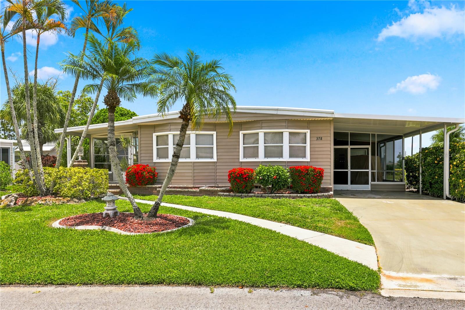Escape to the Florida sunshine at 378 Sumac Crescent in the award-winning Maple Leaf Golf & Country Club, where resort-style living and a welcoming community create the perfect winter retreat or year-round home. Ideally situated on a spacious perimeter lot with lush green space behind offering the privacy and peaceful setting you've been searching for. Designed for enjoying Florida's beautiful weather, the home features an impressive 445 square feet of covered and screened outdoor living space, along with a 310-square-foot enclosed lanai that provides additional year-round living and entertaining space. Whether you're sipping your morning coffee, hosting friends after a round of golf, or simply relaxing with a good book, you'll appreciate the seamless indoor-outdoor lifestyle. The 128-square-foot storage shed serves as a convenient workshop while also housing the laundry area and providing plenty of extra storage. Being offered turnkey furnished, this home allows you to arrive with your suitcase and immediately begin enjoying everything Florida has to offer. A golf cart is included, making it easy to explore the community and its outstanding amenities. Located less than half a mile from three of the community's four heated swimming pools, you'll be just minutes from meeting neighbors, joining activities, or simply soaking up the sunshine. Inside, the beautifully updated kitchen is both stylish and functional, offering an inviting space to prepare meals and entertain. The spacious primary suite opens directly to the enclosed lanai through sliding glass doors and includes a private ensuite bathroom with a walk-in shower. Your family and visiting overnight guests will appreciate the comfortable second bedroom and conveniently located guest bathroom with a tub/shower combination. Whether you're looking for a carefree winter escape from the North, a full-time Florida residence, or an excellent investment opportunity, this move-in-ready home checks all the boxes. AC replaced in November 2019. ***Be sure to check out the two virtual tours links including a 3D virtual tour and video walk through. ***. Maple Leaf is a resident owned 55+ community with an active resort lifestyle. Activities include award winning par 62, 18 hole golf course, 4 heated swimming pools, 5 tennis courts, bocce, lawn bowling, 2 shuffleboard court centers, 2 hot tubs, sauna, fitness center, woodworkers shop, pottery studio, 4 pickleball courts, two restaurants, full service bar, tiki hut with bar and over 75 clubs and activities. Price of home includes membership certificate. It's true what they say, it's all about the lifestyle.