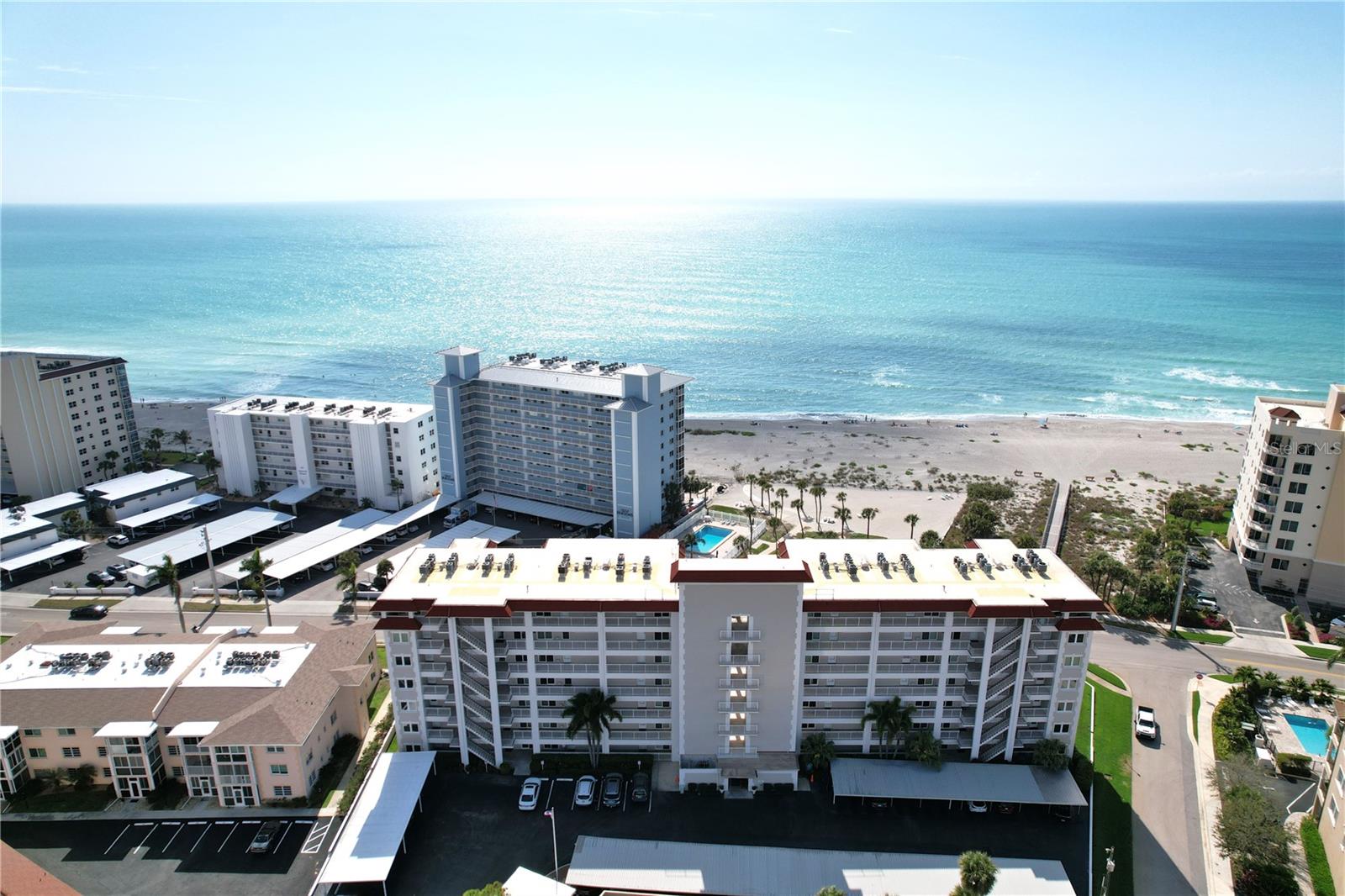 2/2 Ocean front View the Gulf of Mexico / Venice Florida.
Unit 604 at 500 The Esplanade N –  2-bedroom, 2-bathroom end-unit condo located in one of Venice Island’s most desirable Gulf-front communities.  View the peaceful Gulf and coastal comfort. The six floor end-unit offers 1,165 sq ft of light-filled living space, thanks to extra hurricane windows that fill the condo with natural sunlight. The spacious living and dining areas overlook the Gulf of Mexico, providing a serenity setting for everyday relaxation or entertaining. The primary bedroom includes a large closet, an suite bath, and tranquil Gulf views.  Guest bedroom and second full bath provide comfortable space for visitors.  Newer A/C and hot water heater.   Laundry facilities with additional storage are conveniently located just steps away on each floor, and the unit includes assigned covered parking.  Exclusive Amenities Just Across the Street Enjoy access to a private beach area, heated pool, grill station, and shuffleboard courts—reserved for residents and their guests. Whether you’re soaking up the sun or winding down after a beach walk, these amenities elevate the island lifestyle.  Ideal Venice Island Location Only minutes from historic downtown Venice, with easy access to restaurants, boutique shopping, the Venice Fishing Pier, and local arts and events. Whether you’re looking for a full-time residence, vacation home, or investment, this location offers it all.
Gulf Twin Towers owns over an acre of gated Gulf-front, beach-front property, unique to Gulf Twin Towers, with 170+ feet of private beachfront, a heated pool, lounge seating, and tropical landscaping.
Close to local amenities, beaches, and Tiki Bars and Live entertainment. The best game fishing in the world with off speed boat racing to spring training baseball teams as The Atlanta Braves and Tampa Rays. Just want to go to the beach or go fishing for the day. Great to do it all with whatever you can dream or do as a hobby. Local International Airports: Fort Myers, Sarasota and local Punta Gorda with Allegiant airlines direct. Many outdoor concert venues weekly. Local parks, state parks, tennis or pickle ball, to amazing golf courses. You deserve to view this property and make it your home or investment.