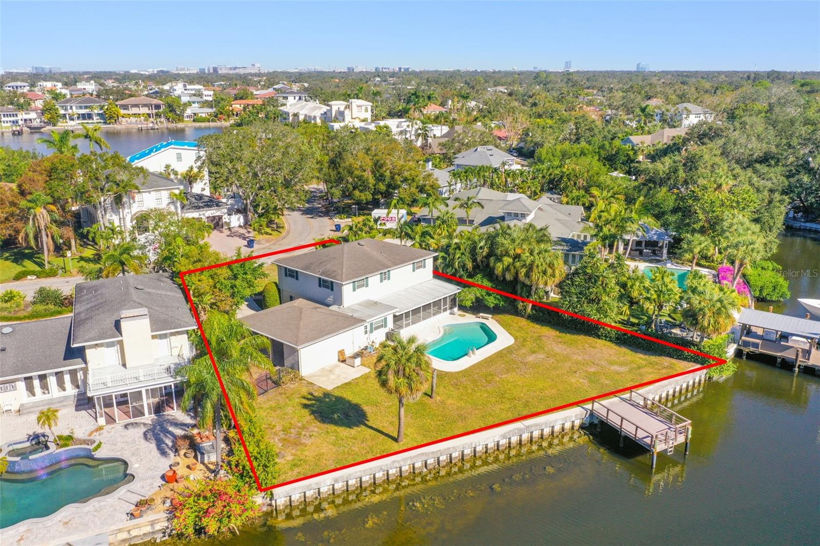 Waterfront Paradise – Build Your Dream Retreat! Seize this exceptional opportunity to create your dream waterfront haven or invest in this prime property offering direct open water access! This extraordinary lot boasts an updated seawall (2018) and dock (2019), setting the stage for endless waterfront enjoyment and activities. This home is thoughtfully upgraded to combine style and functionality. Recent updates include energy-efficient double-pane windows for lasting durability and energy savings. Additionally, underground electrical lines not only enhance safety but also boost curb appeal. Nestled in the coveted Plant School District, this stunning property offers the perfect blend of charm and convenience. Enjoy the unbeatable proximity to Tampa’s finest dining, shopping, and entertainment options, while soaking in serene bay views. Builders, investors, and visionary homeowners alike will appreciate the value and potential of this rare gem. Don’t miss your chance to own this slice of waterfront paradise—schedule your viewing today! Buyer can receive lenders credit toward buyer prepaids and closing costs (based on the loan amount) if buyer closes their loan with Pineapple Home Loans.