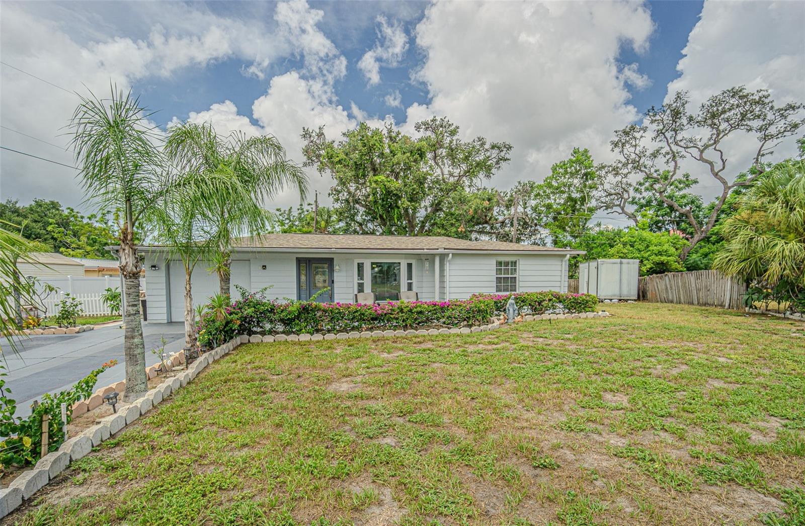 Welcome to this beautifully maintained single-family home nestled on a spacious 0.23-acre lot in the desirable Beacon Hills neighborhood of New Port Richey. Proudly cared for by the same owners for more than two decades, this home reflects true pride of ownership and has been meticulously maintained throughout the years.

Offering 1,328 square feet of comfortable living space, this home features a one-car garage plus an additional storage shed, providing plenty of room for tools, lawn equipment, or hobbies. Step outside to the large backyard where a concrete patio creates the perfect setting for weekend barbecues, family gatherings, or entertaining friends.

Major updates provide added peace of mind, including a new roof (2019), A/C system (2018), and new high-impact front bay windows and sliding glass door installed in 2026, enhancing both energy efficiency and storm protection.

Enjoy the freedom of homeownership with no CDD fees, no monthly HOA fees, and the added benefit of being located outside the flood zone, potentially saving on insurance costs.

Conveniently located near downtown New Port Richey, shopping, restaurants, parks, medical facilities, and just a short drive to Clearwater, Tampa, and the beautiful Gulf Coast beaches, this property offers the perfect combination of comfort, convenience, and value.

Whether you're searching for your first home, or simply want a move-in-ready property in a well-established neighborhood, this home is ready to welcome its next owners. Schedule your private showing today and see why this lovingly maintained home stands out from the rest.
