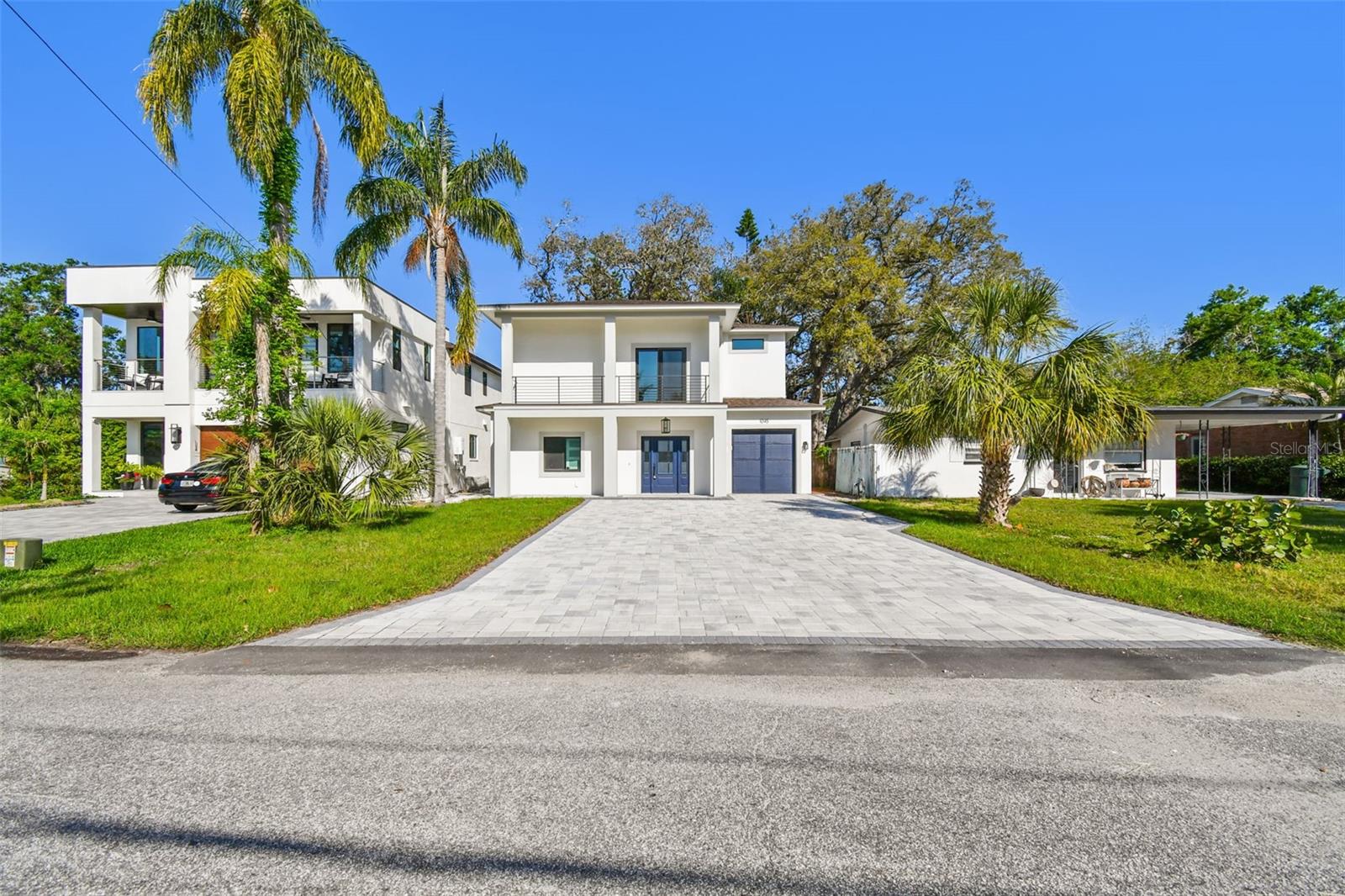 One or more photo(s) has been virtually staged. Experience your dream home in this thoughtfully designed, newly built, single family residence, in sought after Safety Harbor.  Here, you'll live walking distance to downtown Safety Harbor and one block from the Bay. Experience numerous outdoor living areas and a third story terrace - your own private oasis! Inside you will be greeted with an open layout - the main floor has two bedrooms - a downstairs master, and a guest room or office - as you wish!  Step into a kitchen with an oversized book-matched quartz island, large enough to fit the entire family. This area also has its own wine and bar room, flowing right outside to one of four private outdoor living areas - perfect for living and entertaining.  Adorned with custom hard wood cabinets as well as Delta faucets and fixtures throughout, you'll be surrounded by quality. Enjoy plenty of natural light throughout the home via your brand-new hurricane impact rated windows. This house is a great size but yet still offers you a sizeable front and back yard with covered patios. The trees were purposefully maintained to provide ample shade to allow for residents and guests to enjoy Florida's outdoor lifestyle.  Lot is pre-plumbed for you to add your own custom landscaping. You'll live and entertain here as the open kitchen area offers pass-through windows to entertain family and friends, maintaining a connection with the outdoors at each turn. Upstairs you'll find a second family room, theatre room, and three more bedrooms with high ceilings. Spacious closets, and a Jack and Jill bathroom await you here. A master with two walk-in closets, a double shower with body sprays, balcony, and more! Enjoy the convenience of a spacious second-floor laundry room with natural gas hookups. Relax on your back deck or walk upstairs to entertain guests on your very own, unique, sizeable, and private third story crow's nest! Here you can take in the water views of Tampa Bay or stargaze at night!  This one-of-a-kind home offers instant equity as compared to new builds coming up in downtown Safety Harbor.  

Furthermore, buy this dream home with peace - it is up and out of a flood zone, and is built to stand - no issues at all during the recent hurricanes. Come by and take a look!