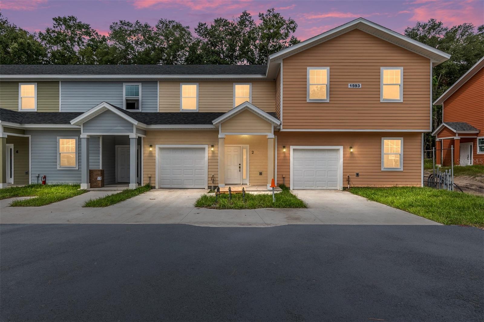 NEW CONSTRUCTION at Eagle Trace, just 2.3 miles from the University of Florida in the heart of NW Gainesville! The Model D features a townhouse style layout with a welcoming covered entry, and a large open living room that offers plenty of space for relaxation and entertaining. An attached one-car garage adds both functionality and convenience, making this home as practical as it is beautiful. Gourmet kitchen with quartz counters, custom soft-close cabinetry, and fully equipped with stainless steel appliances including a refrigerator and freezer, smooth-top range, microwave, dishwasher, and garbage disposal. Double-pane windows, luxury vinyl tile wood-look flooring, and elegant porcelain tile paired with quartz countertops in the bathrooms, and window blinds included too! Eagle Trace has a beautiful lake-view entrance, a pool, clubhouse, and fitness center - all with a low HOA fee. Each condo comes with a 1-year builder warranty. Current seller incentives include a $7,500 buyer credit and Seller will pay 12 months of HOA dues with acceptable contract terms! Please note that the photos are of a recently completed model unit with comparable finishes, but may not reflect the specific floor plan of this unit. Pricing and availability are subject to change without notice. With quick access to UF Health Shands Hospital, UF campus, and vibrant Downtown Gainesville, this new construction condo offers the perfect blend of luxury, affordability, and convenience!