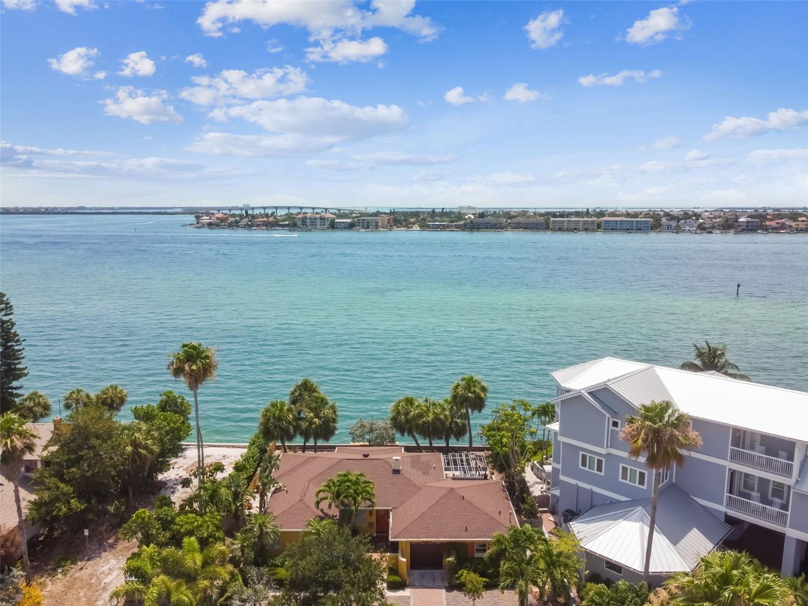 MAJOR. PRICE REDUCTION DUE TO DAMAGE FROM HURRICANE HELENE.  THIS SINGLE STORY HOME IS BEING SOLD AS IS. SELLER IS NOT REMEDIATING THE HOME.  This waterfront property spans nearly 0.21 acres with 82 feet of direct waterfront on Pass-a-Grille Channel.  The lot measuring 82 X100 feet is one of the largest lots on the island. Imagine designing your new home with your private pool and water frontage  with room for multiple docks.  With a variance from the city it may be possible to split this lot into two 41 feet wide lots.  The current minimum is 42 feet.  Please do not go to the property without a  realtor.